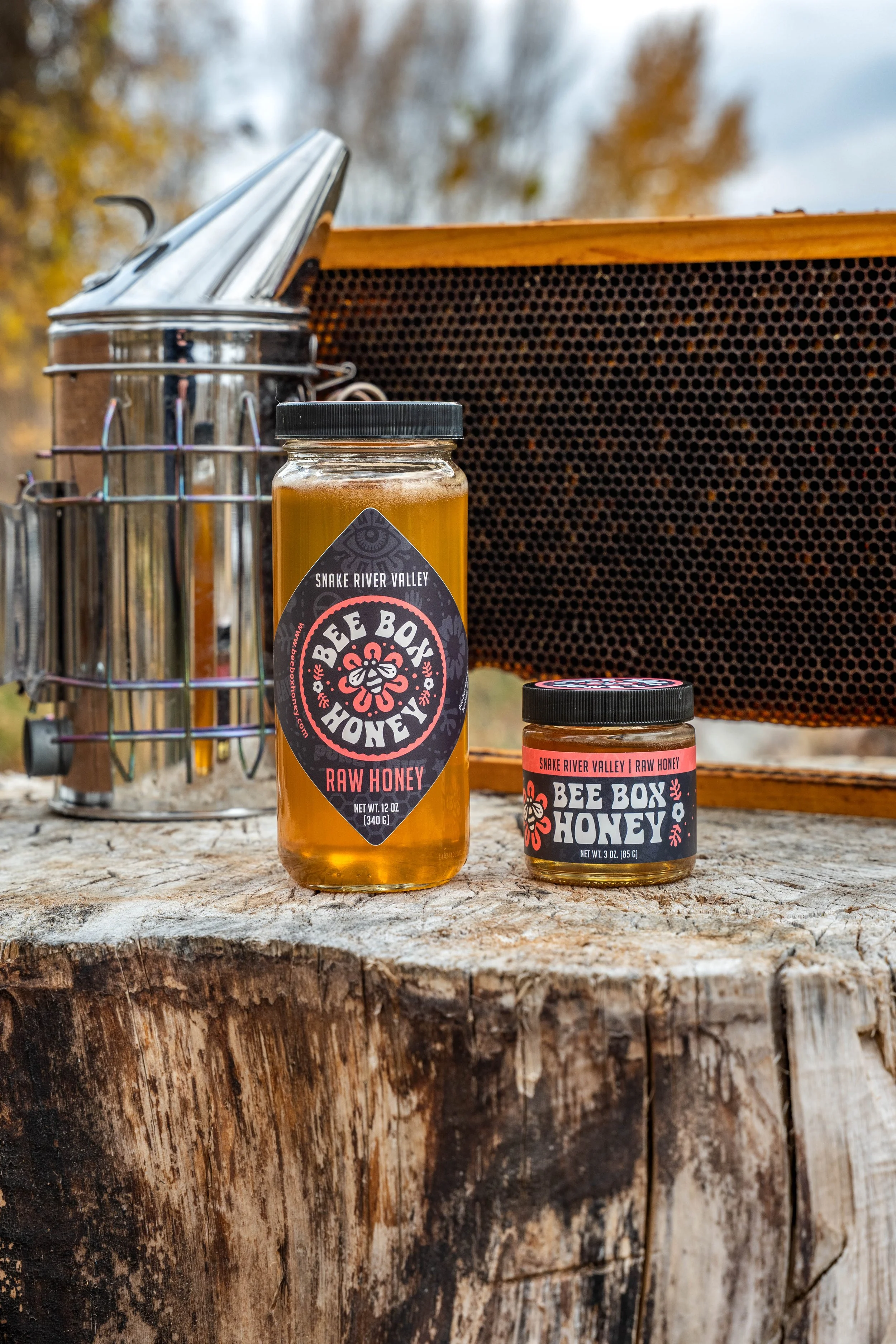 Outdoor commercial image highlighting honey jar design, brand details, and natural product storytelling.