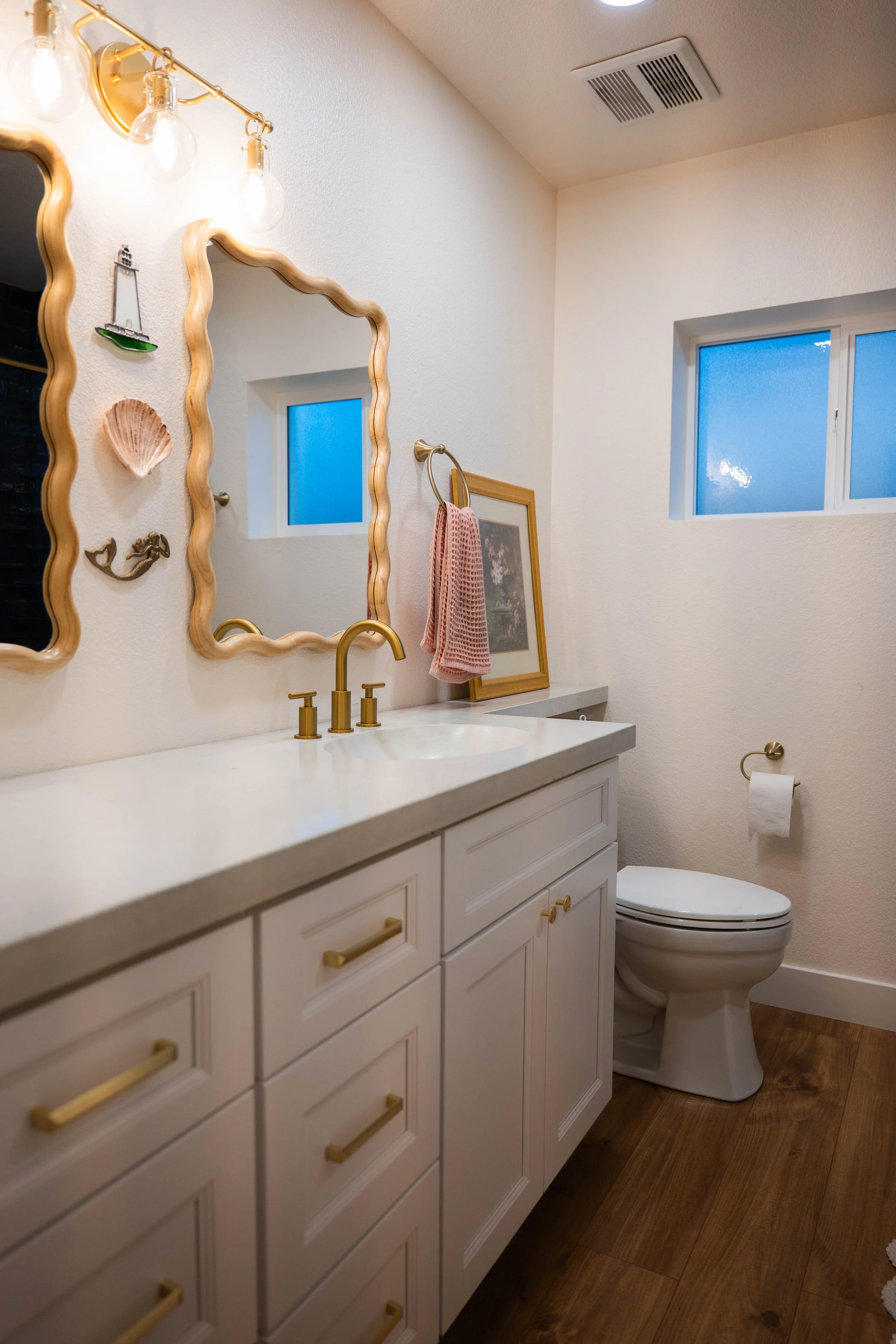 Branding-style renovation image highlighting contemporary bathroom finishes in a Phoenix home remodel.