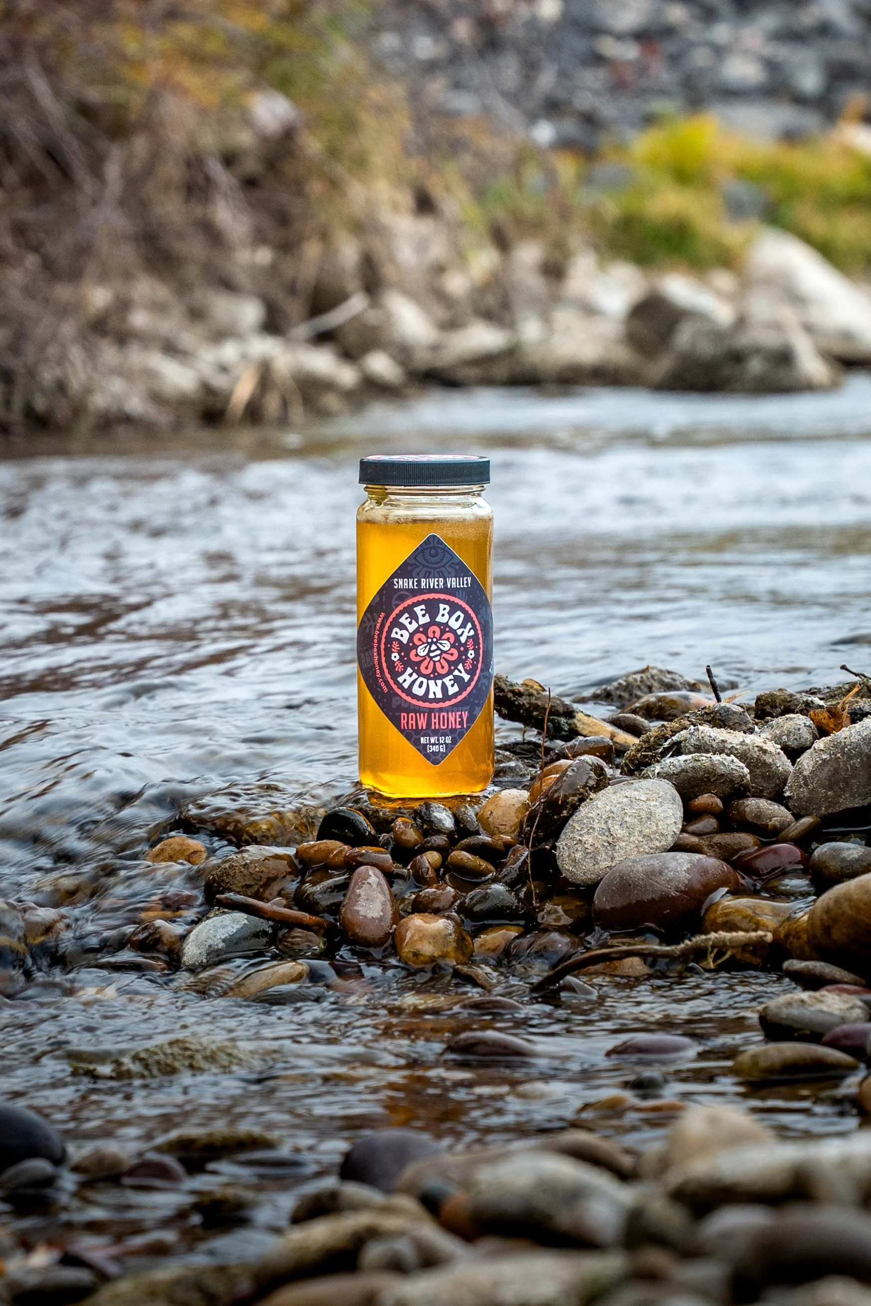 Outdoor product image showcasing artisanal honey with a clean, modern branding design