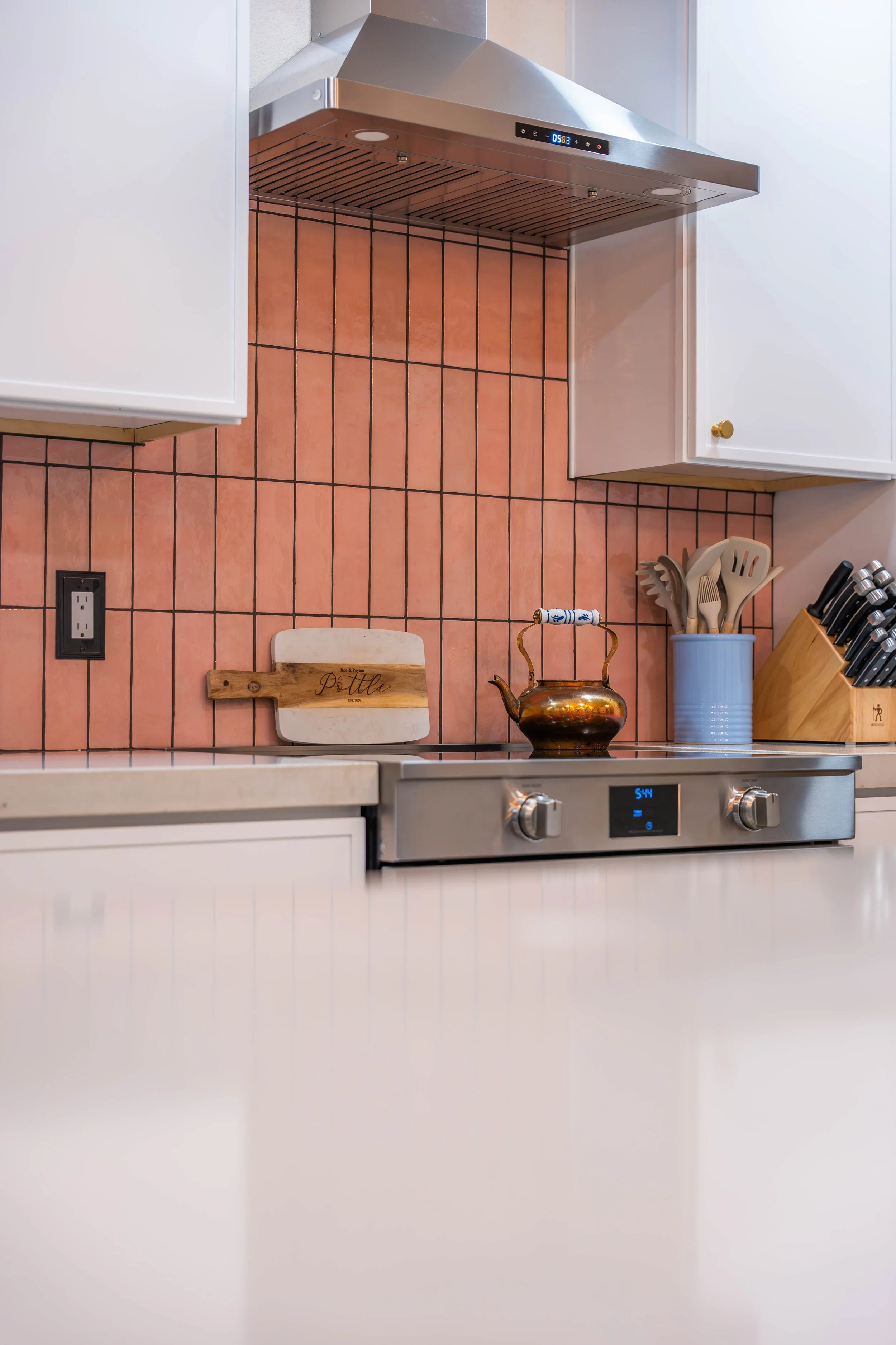 Professional interior photo showcasing updated kitchen cabinetry, countertops, and finishes for a Phoenix construction company