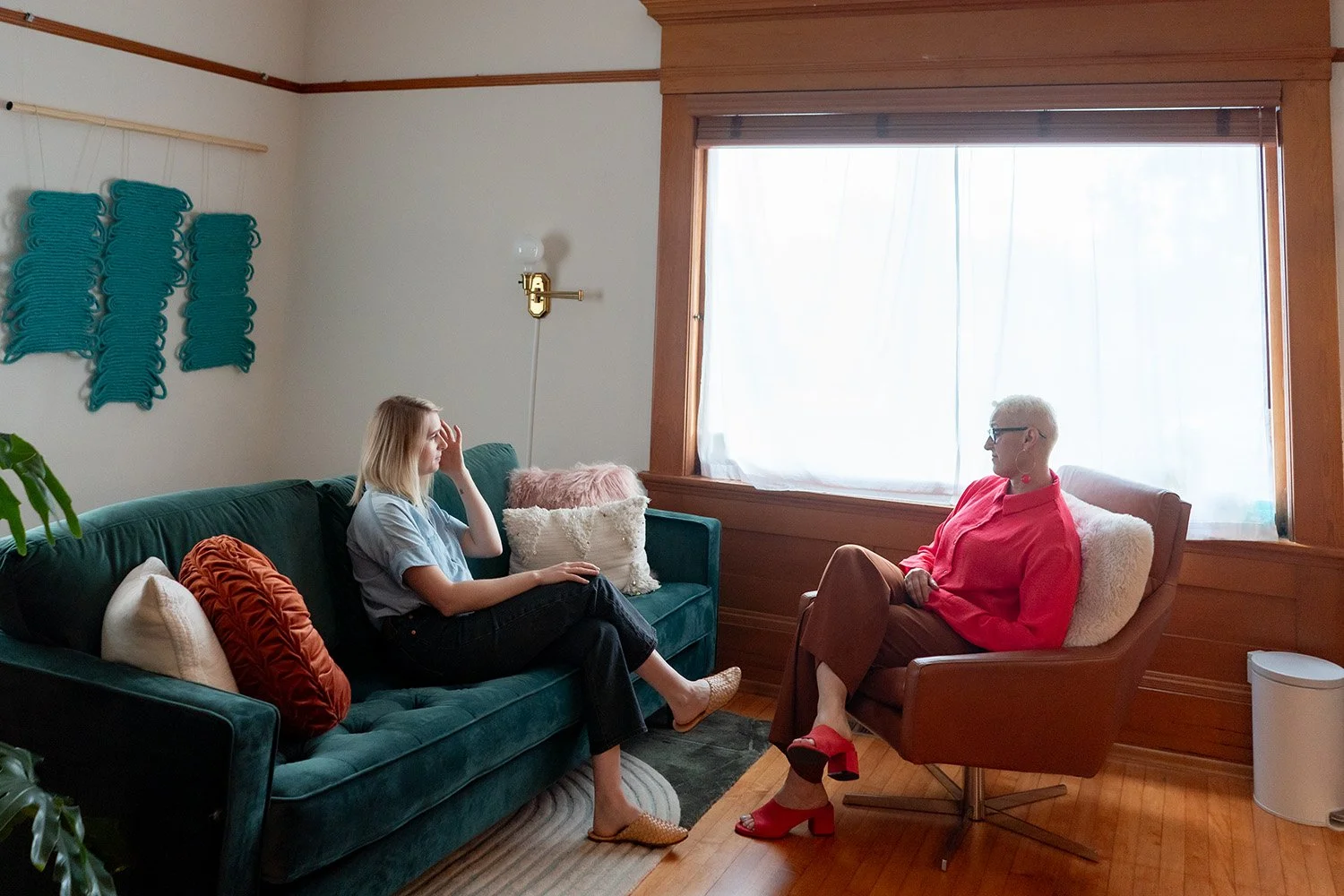 Lisa Kemble talking to client in a therapy session