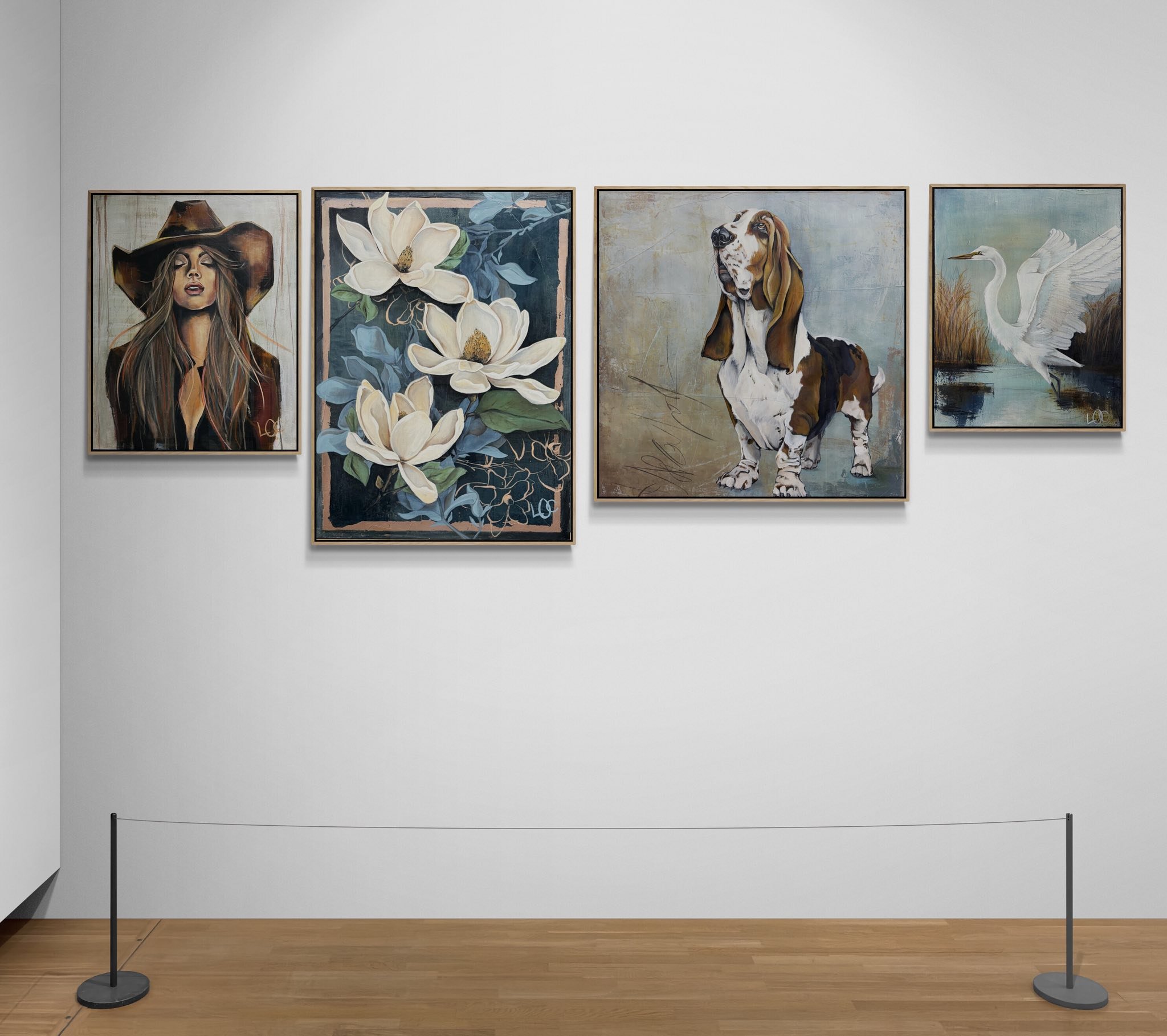 Four framed paintings hung on a white gallery wall. The first painting features a woman with long hair wearing a large hat. The second painting depicts white flowers with green and blue leaves. The third painting shows a basset hound dog on a textured background. The fourth painting depicts a white heron with outstretched wings standing in a marshy area.