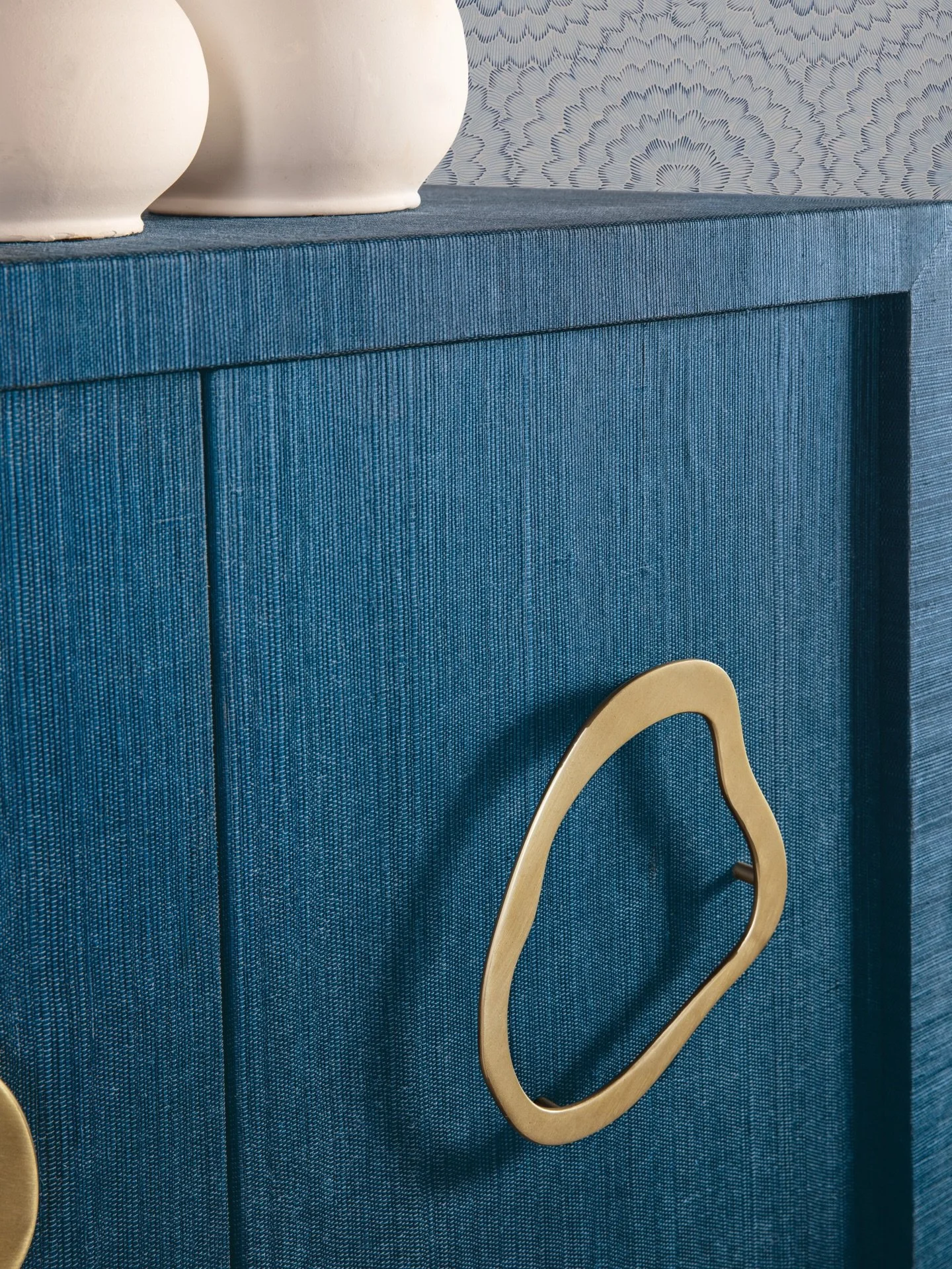 A statement piece with presence. The Paige Five-Door Credenza from the Commerce &amp; Market collection pairs bold scale with rich texture, creating a striking anchor for dining or living spaces while offering generous storage behind its beautifully 