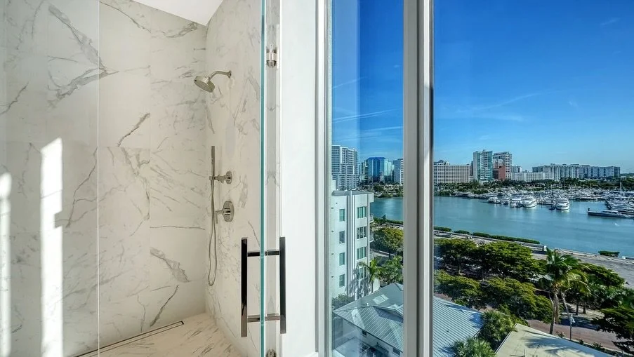 Which bathroom would you choose? 1, 2, or 3?

1️⃣ A spa-like marble shower with floor-to-ceiling views overlooking the water&mdash;your morning routine just became a luxury experience.
2️⃣ Sleek and modern with a statement window, clean lines, and bo