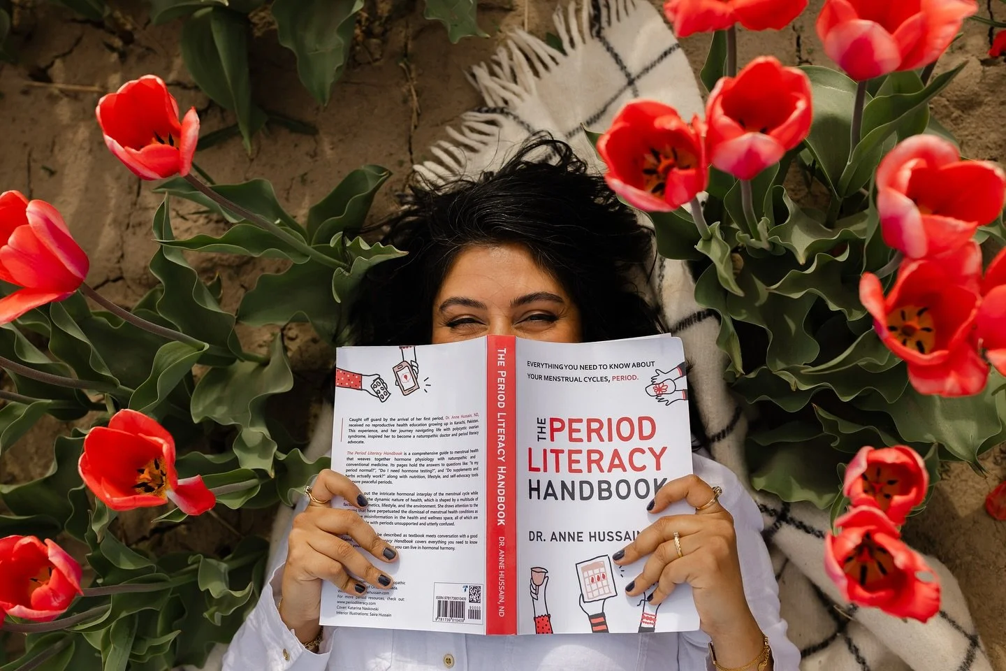 This tulip mini with @dr.annehussain was everything I love about stepping outside the traditional studio box. 🌷

We photographed her surrounded by bold red tulips - a nod to the power, beauty, and realness of the work she does around PCOS, fertility