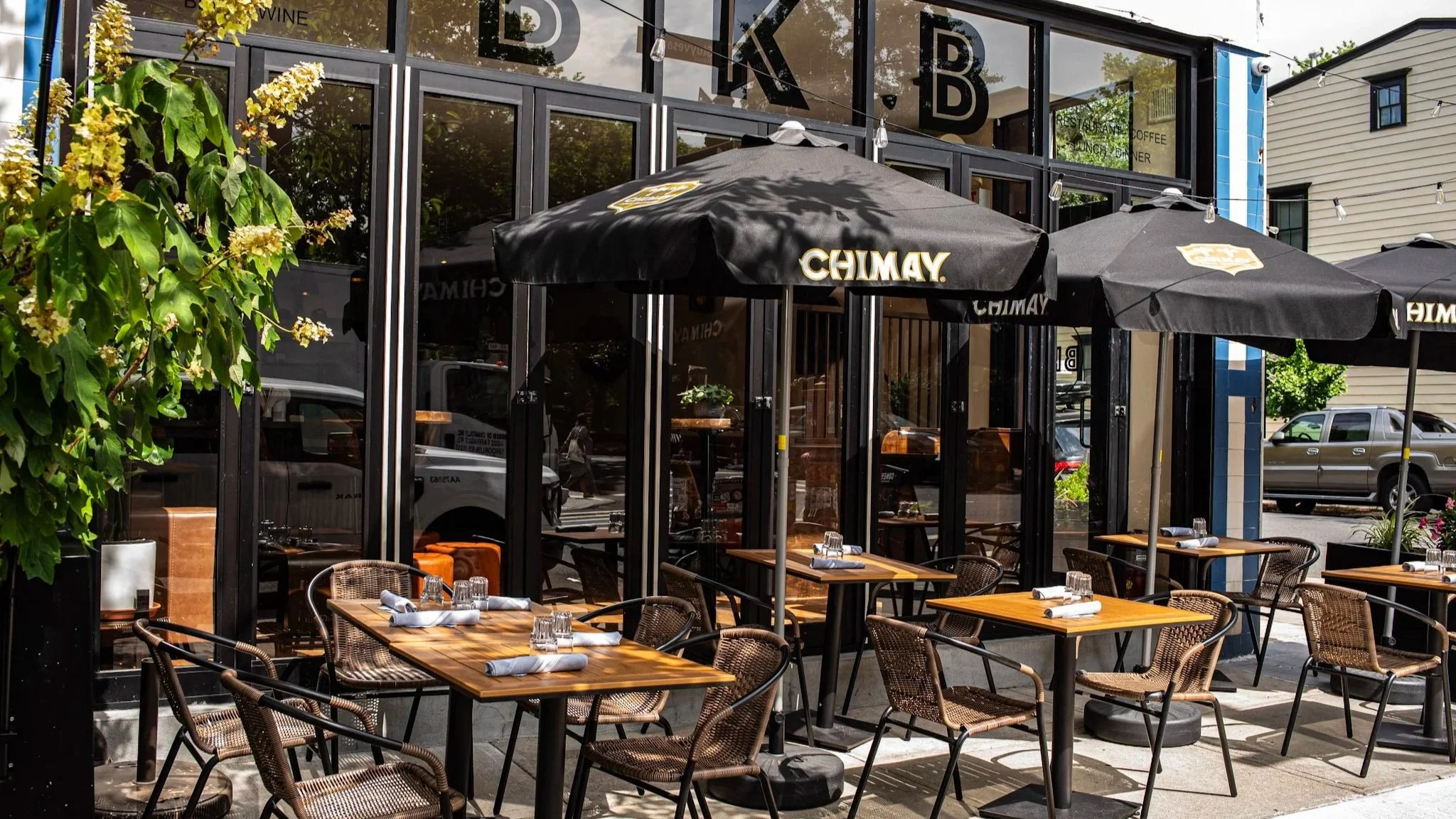 Outdoor patio tables at BKB Brooklyn Brasserie, ready for diners in Brooklyn