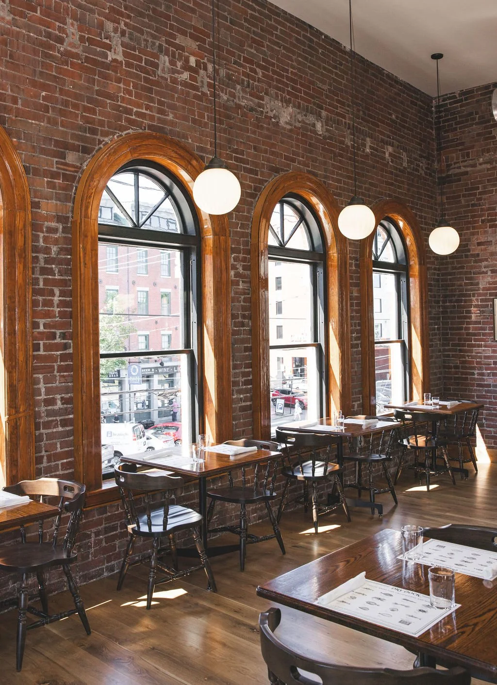 An interior shot of Dry Dock's seating next to a brick wall