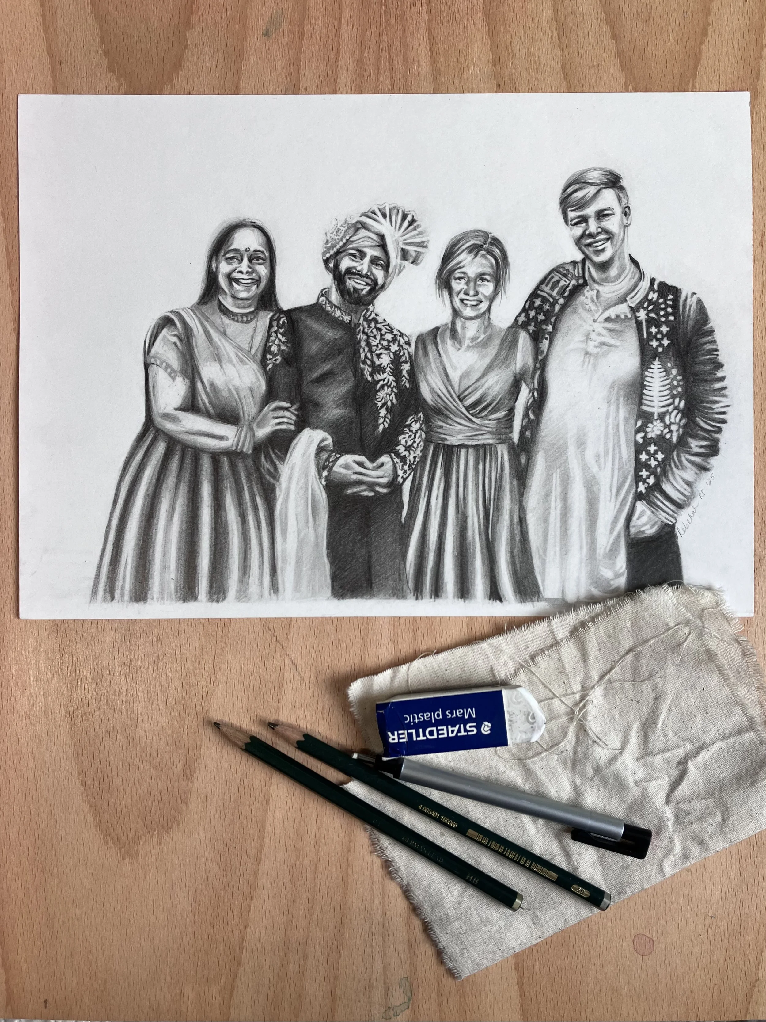 Commissioned wedding drawing by Rebekah Victoria, featuring four people standing together. The hand-drawn artwork is highly detailed, capturing the likenesses, expressions, and attire of the couple and family members, creating a meaningful keepsake.