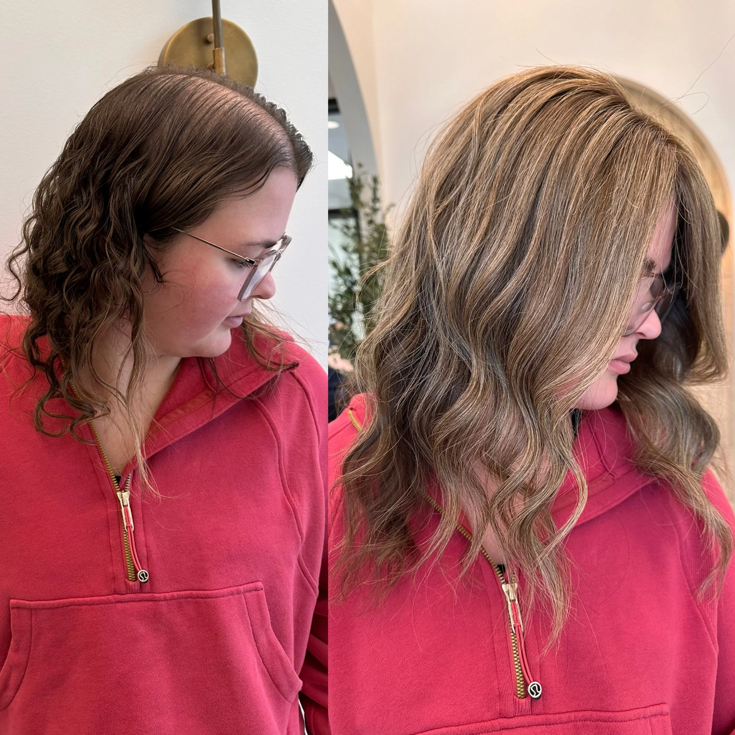 Side-by-side comparison of a woman with shoulder-length wavy hair before and after a haircut and color treatment, wearing a red zip-up hoodie.