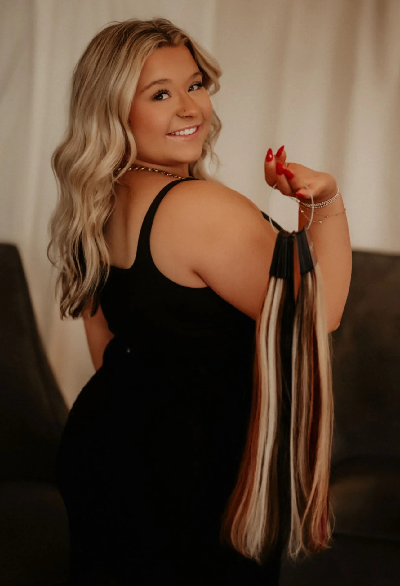 Analise Douglas, hair extension specialist at Calysto Salon in St Peters Missouri. Harper Ellis Hair extensions