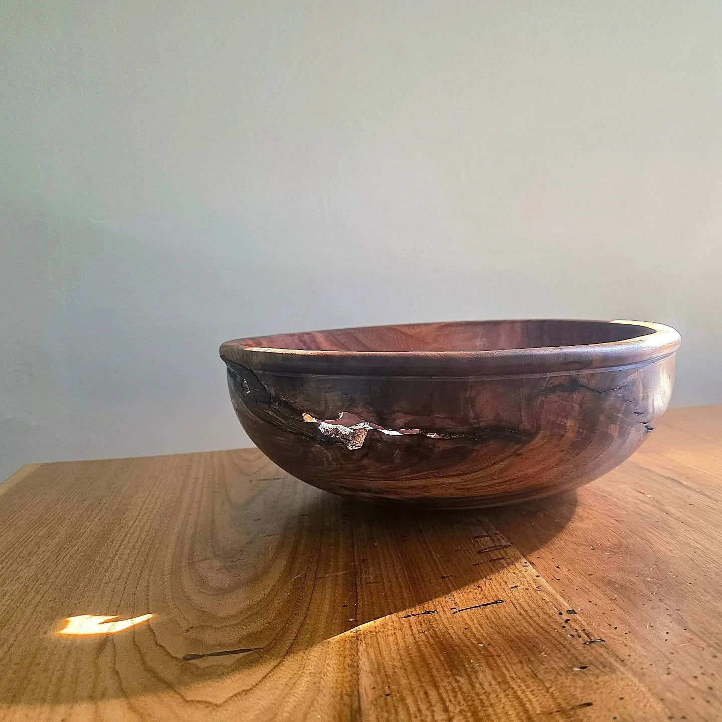 A walnut bowl with dramatic natural inclusions, hand turned to preserve the tension between refinement and decay, transforming salvaged timber into an heirloom centerpiece. 

I'm very pleased with the end result! 
.
.
.
.
.
.
.
#woodturning #madeinvt