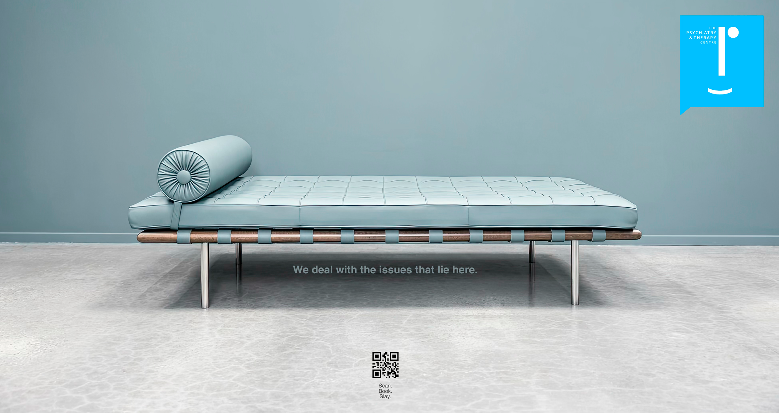 A modern, minimalist lounge chair with a light blue cushion and matching cylindrical pillow against a light blue wall, with a quote beneath reading 'We deal with the issues that lie here.'
