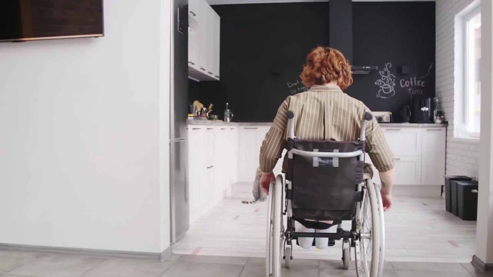 Man in wheelchair navigating home .jpg