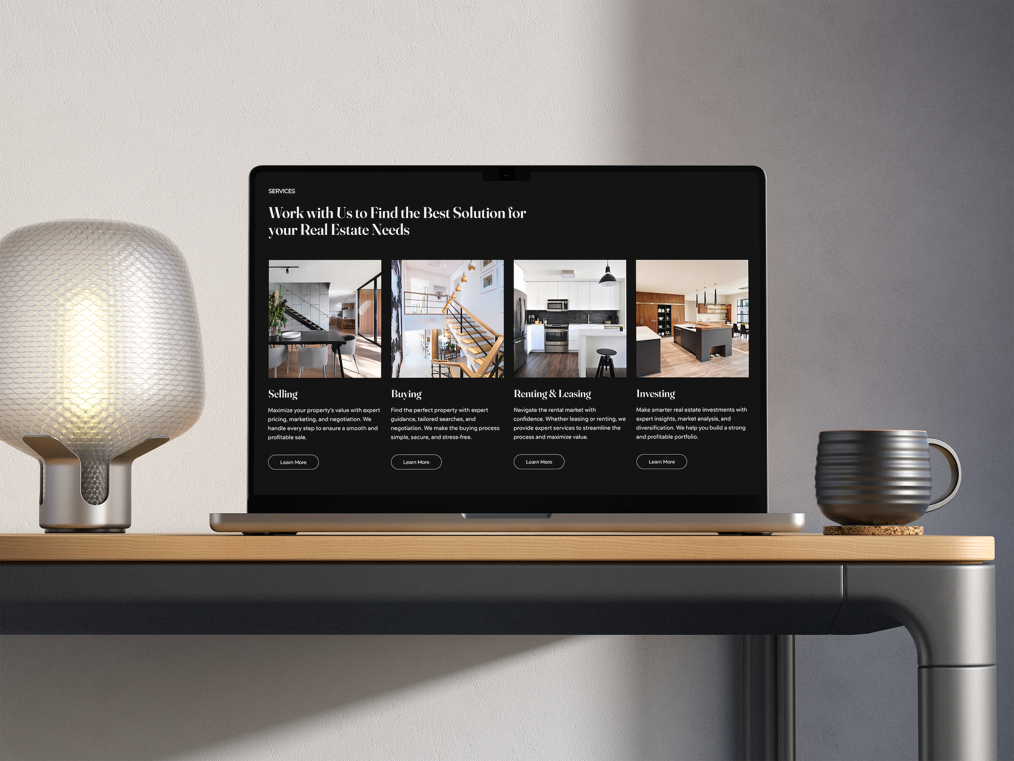 Laptop on a desk displaying a real estate website with options for selling, buying, renting, and investing in properties. Two decorative lamps and a coffee mug are also on the desk.
