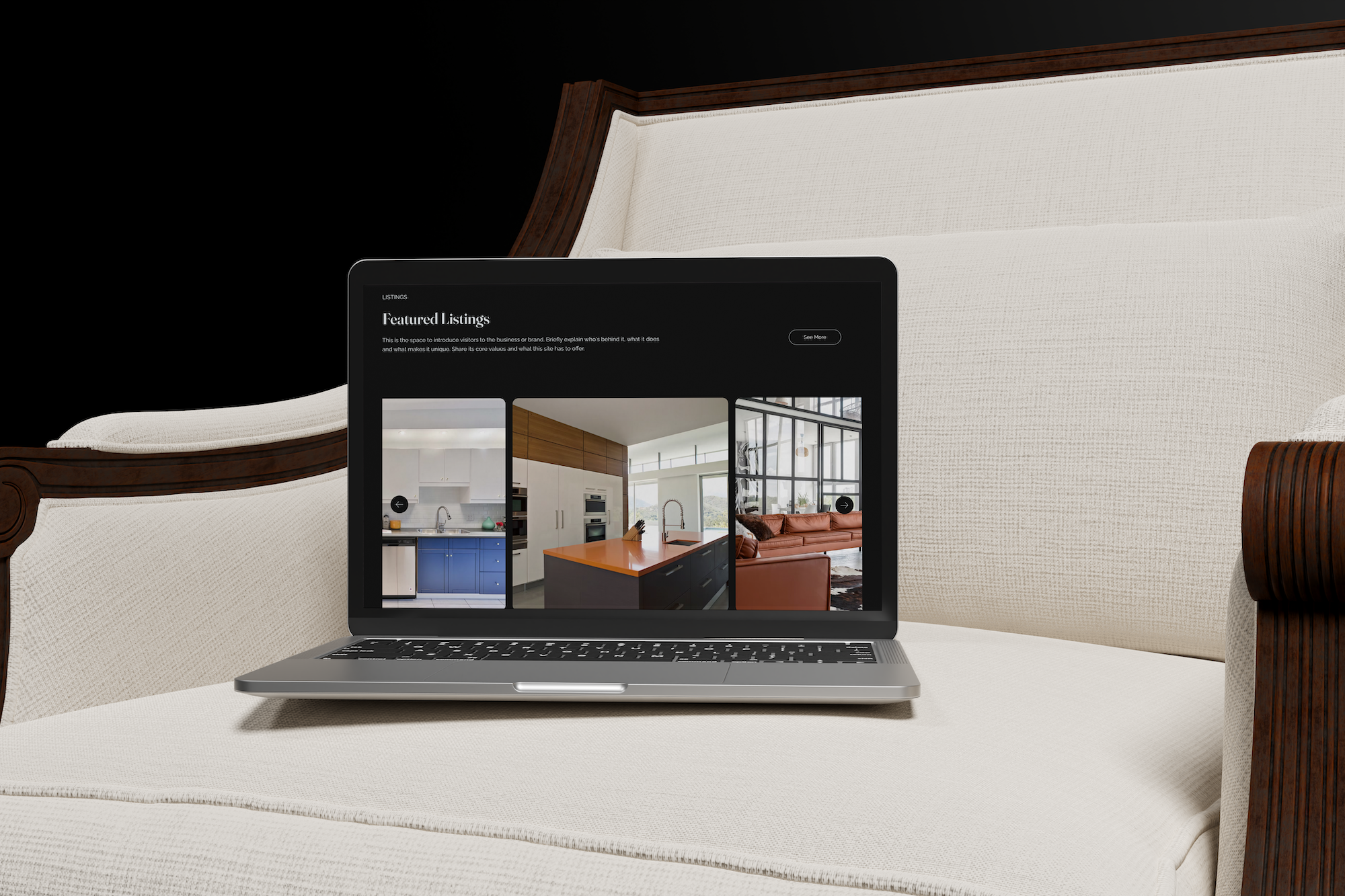 Laptop displaying real estate listings, placed on a cream-colored sofa with a wooden frame.