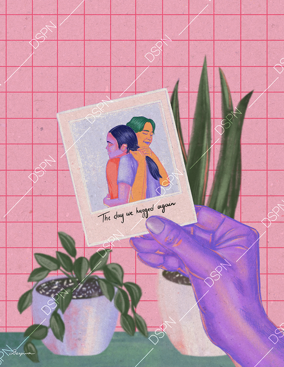 A hand with purple skin holding a photo of two women embracing, with a caption that reads 'The day we hugged again.' The background features a pink grid pattern with two potted plants, one with broad leaves and one with spiky leaves.