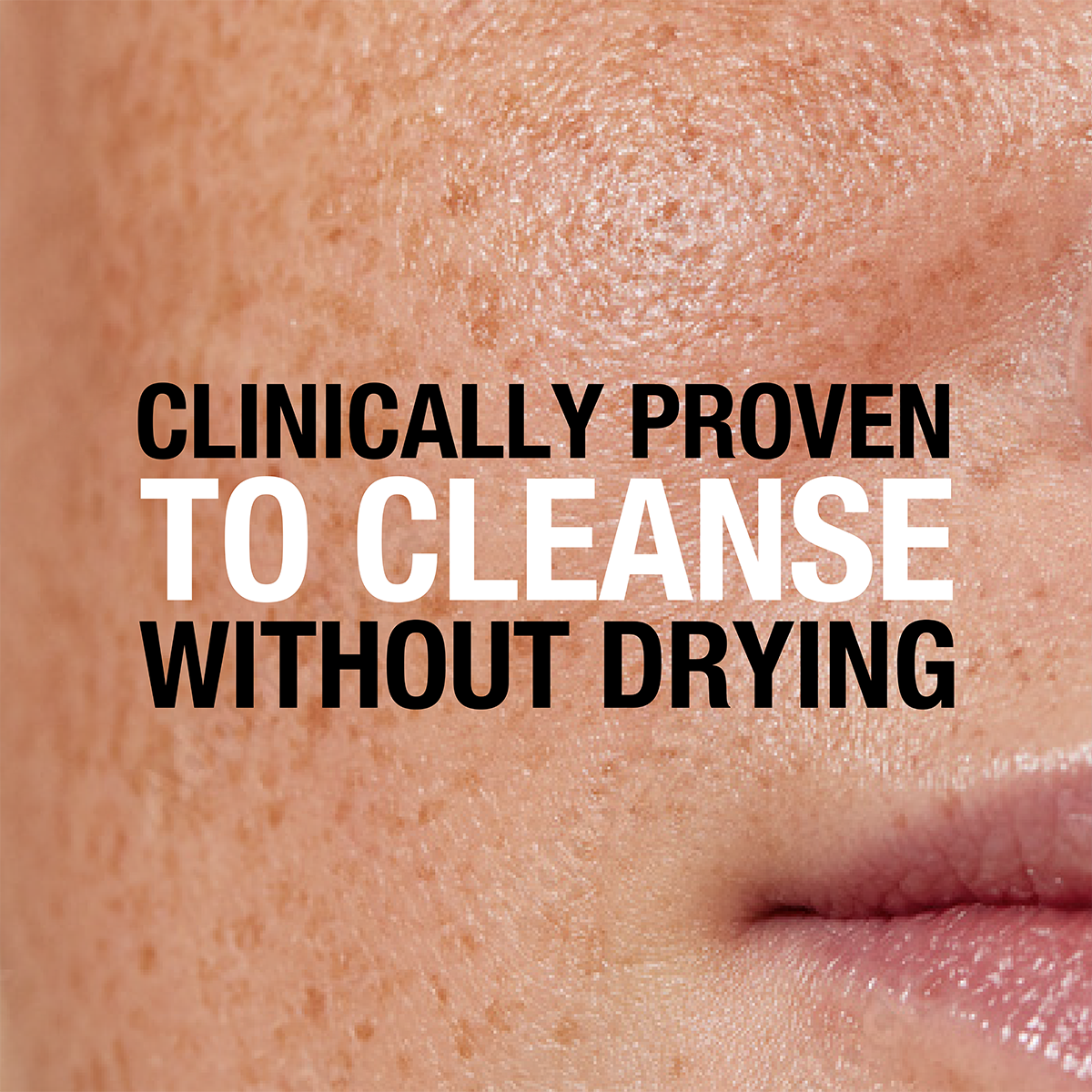 Close-up of a person's face with visible skin texture and pores, overlaid with bold text stating "Clinically proven to cleanse without drying."