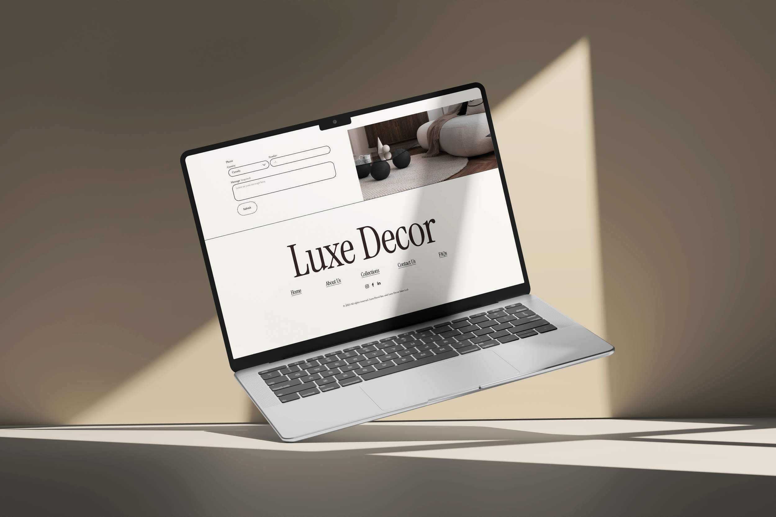 Laptop floating with Luxe Decor website on screen, showing a contact form and a bathroom interior with black vases, and a shadow of the laptop on the surface.