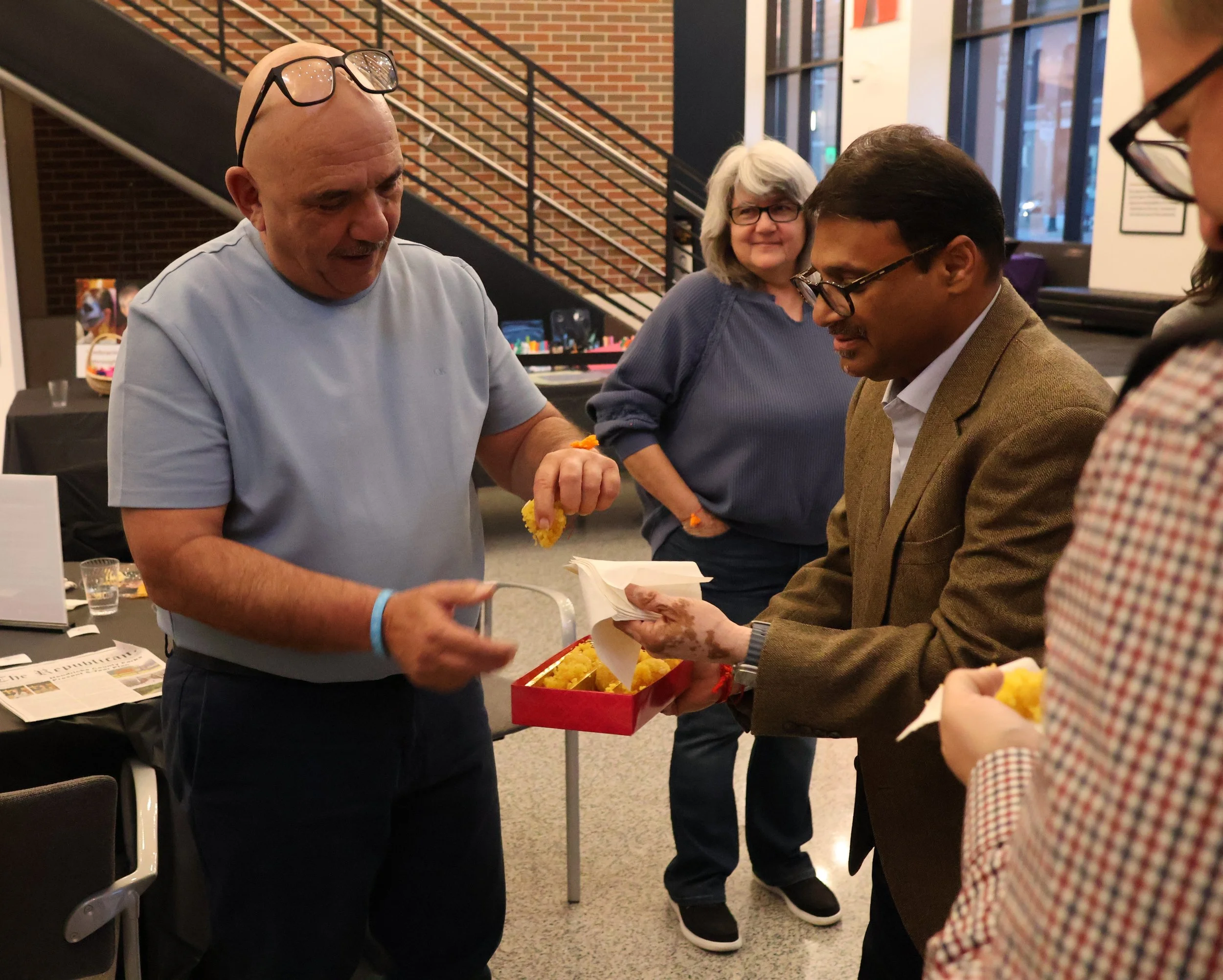 JR Sandadi passing out treat.JPG