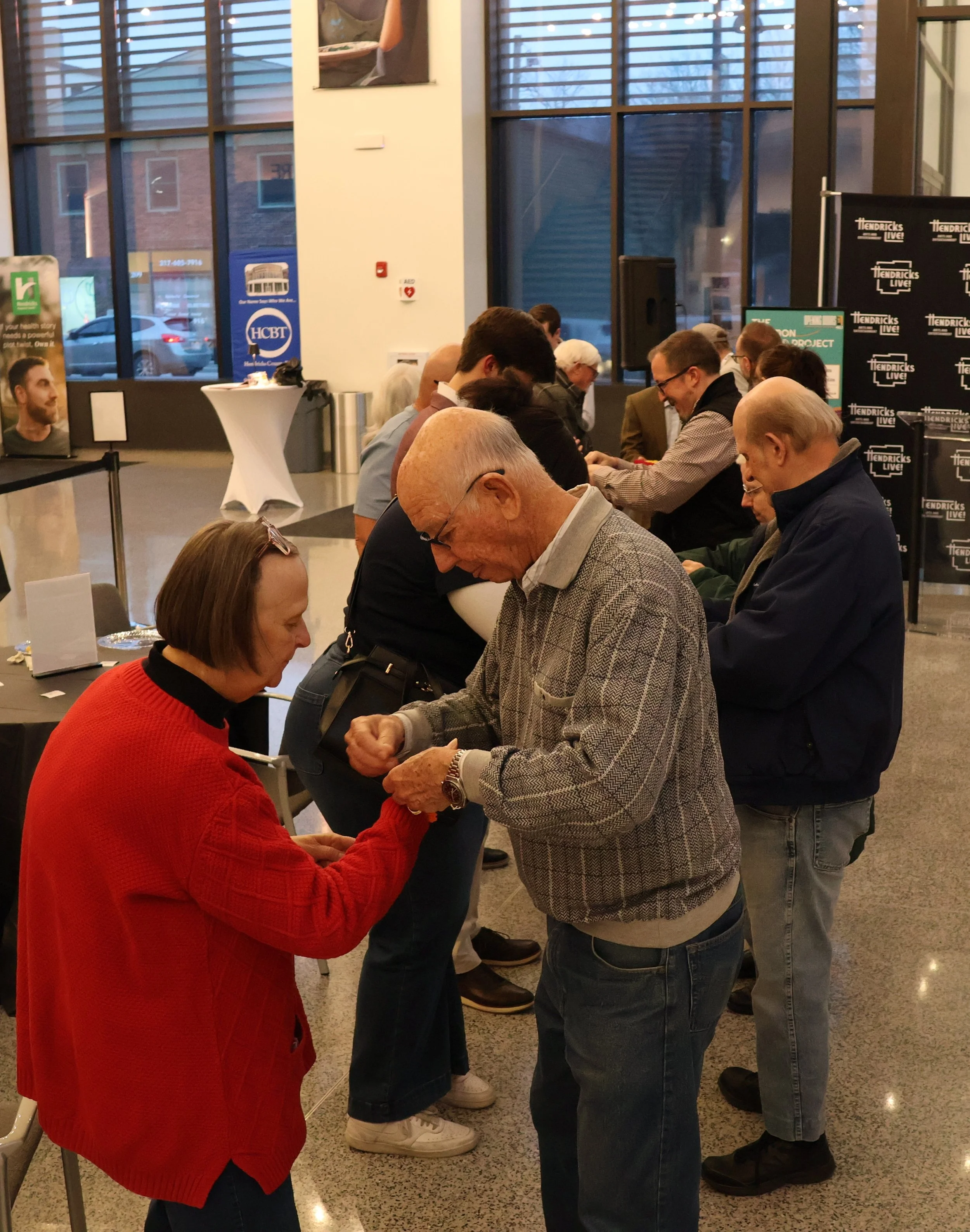patrons tying the Raksha Sutra II.JPG