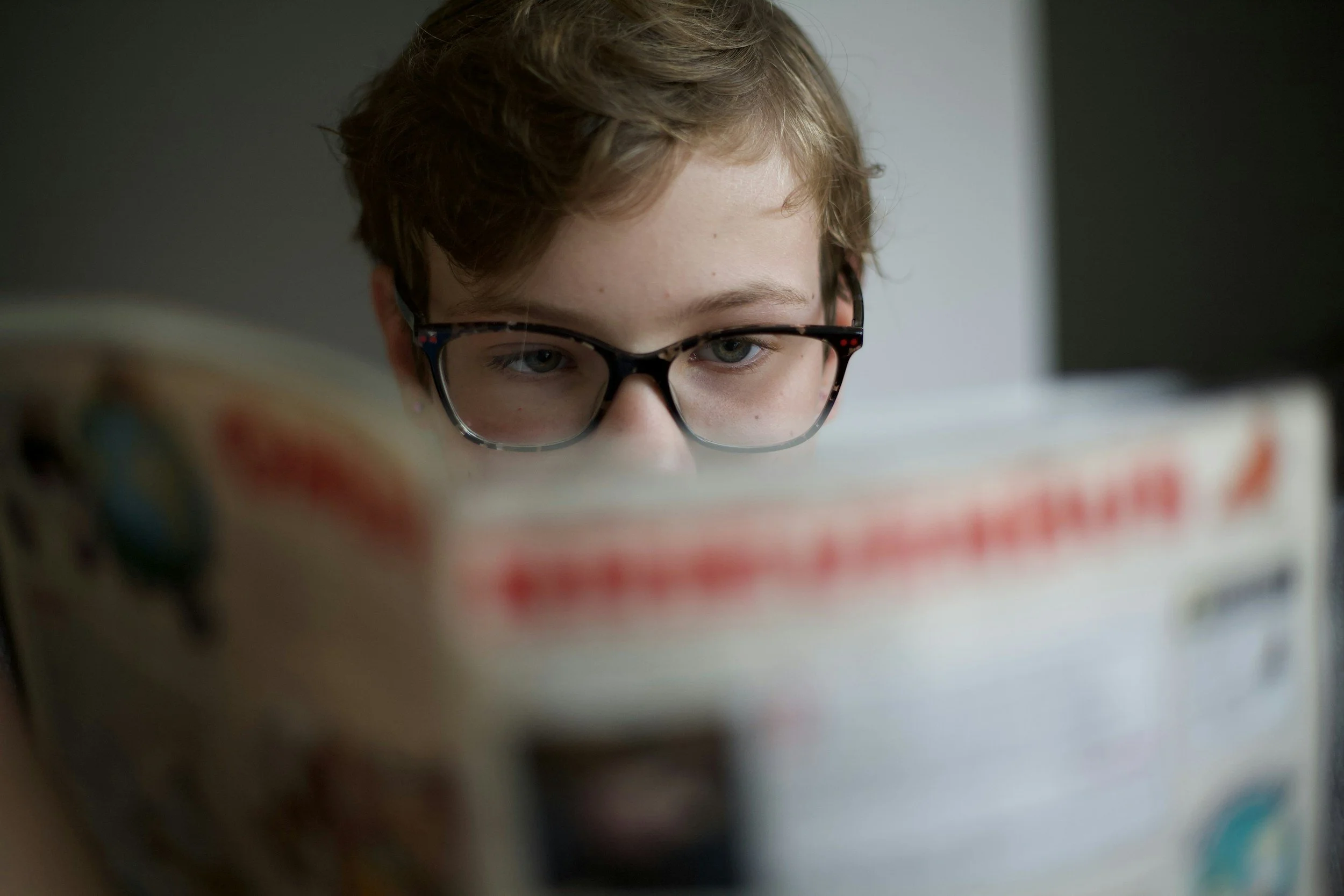 kid reading local hendricks county newspaper