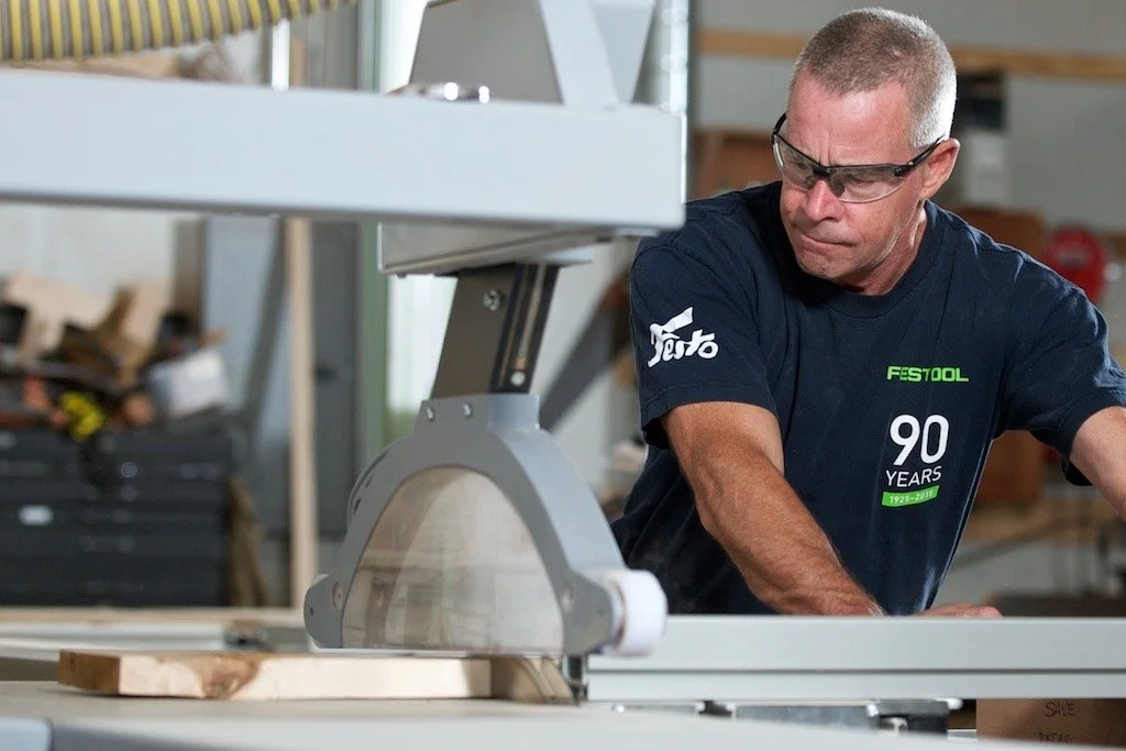 Picture of owner, Harry Slutter, working at Urban Specialty Woods. Wearing a Festool shirt.