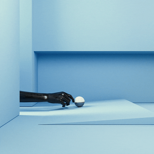 A black robotic hand reaching for a white ball on a flat surface in a blue room with minimalist design.