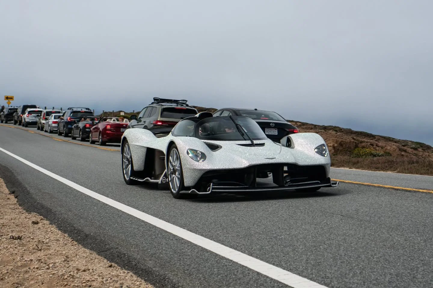 Monterey Car Week at Big Sur, Part II - The Hypercars 

Echos of V-8, V-10, and V-12 engines off in the distsnce provide a sonorous vocal track to the rhythmic beat of the Pacific Ocean's waves crashing upon the shores. Vibrant dots of color dart dow