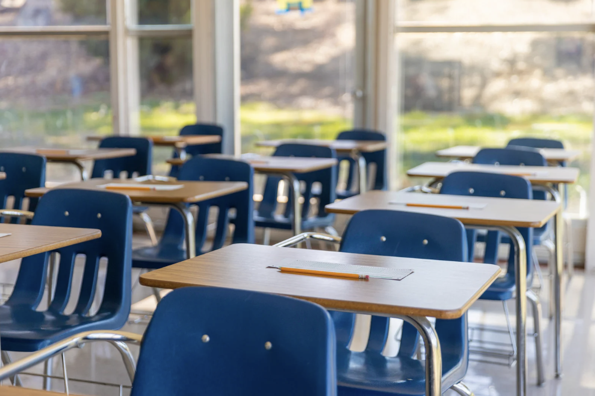 Brightly lit classroom with blue chairs