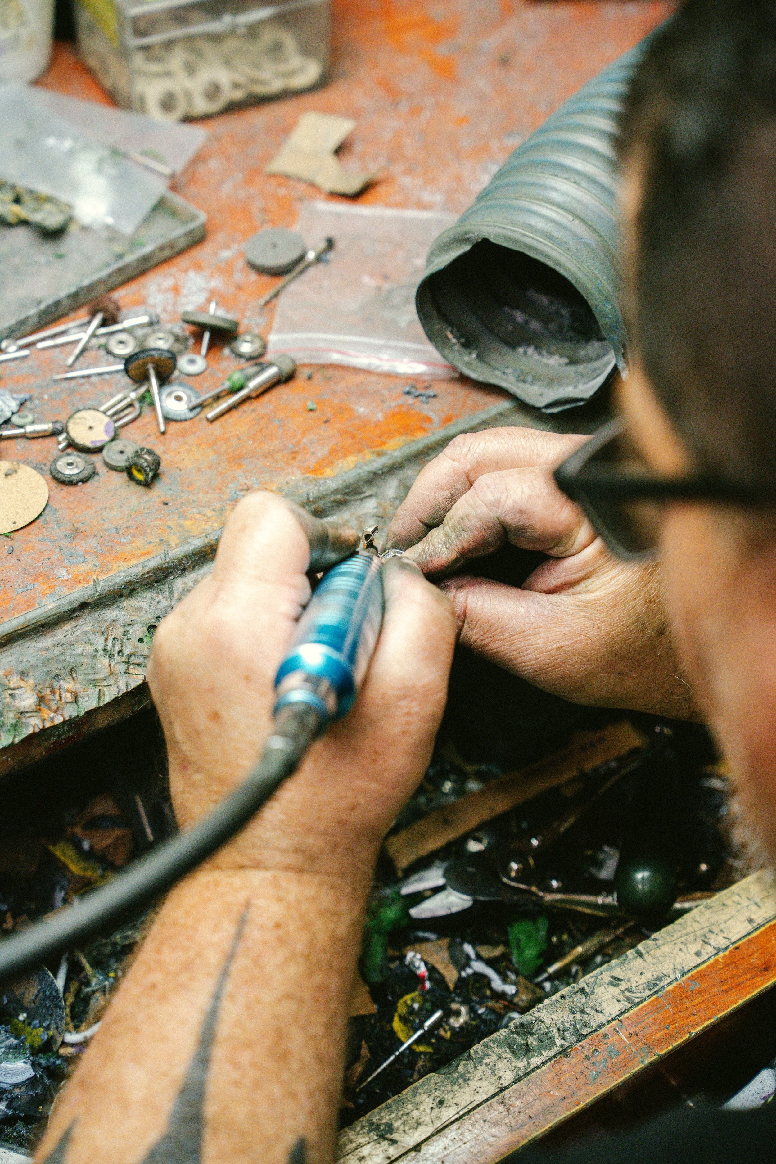 jeweler working on a jewelry repair in the workshop