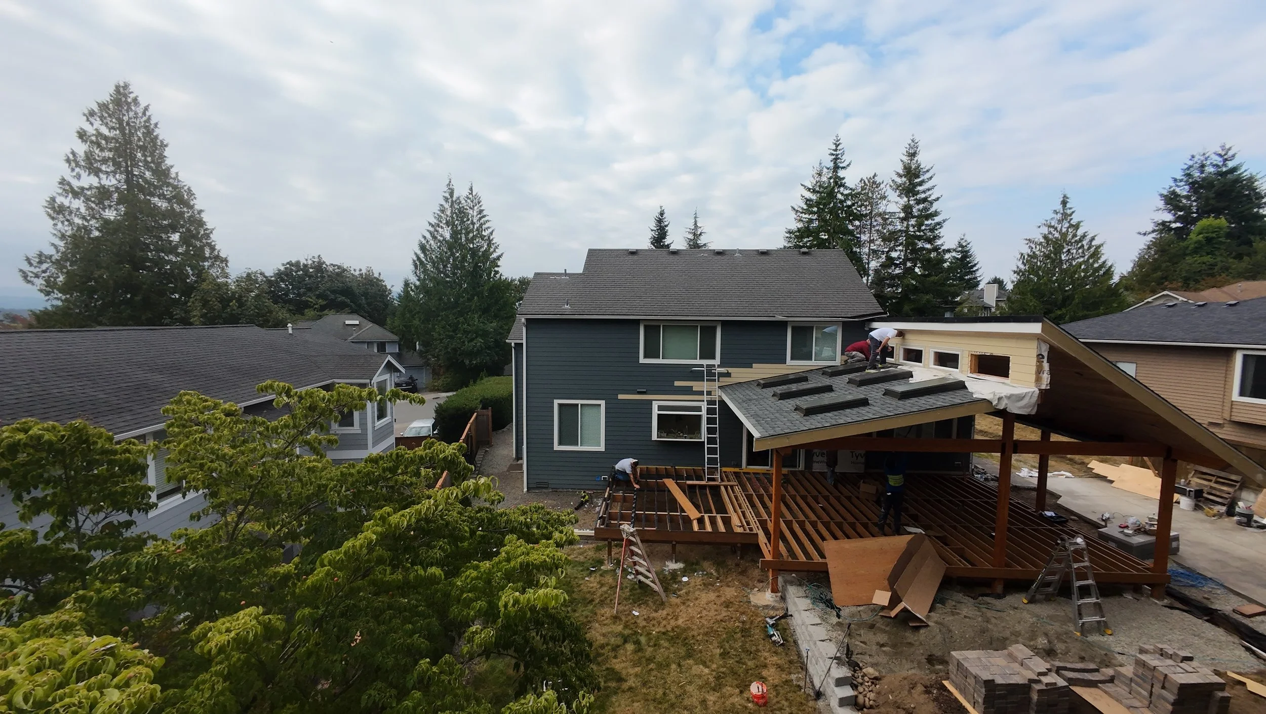 New covered deck with matching shingles in process