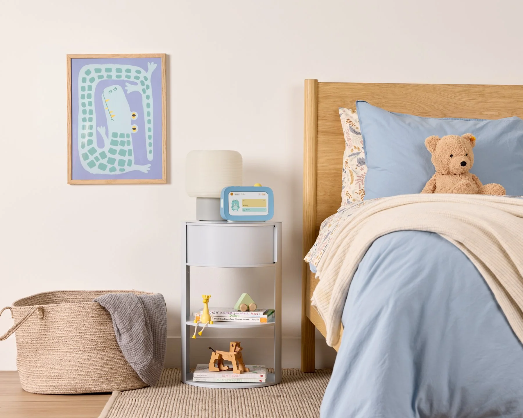 Blue task tracking device for children called Skylight Buddy shown in a children's bedroom