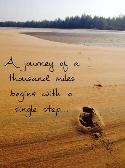Footprints on a sandy beach with text "A journey of a thousand miles begins with a single step."
