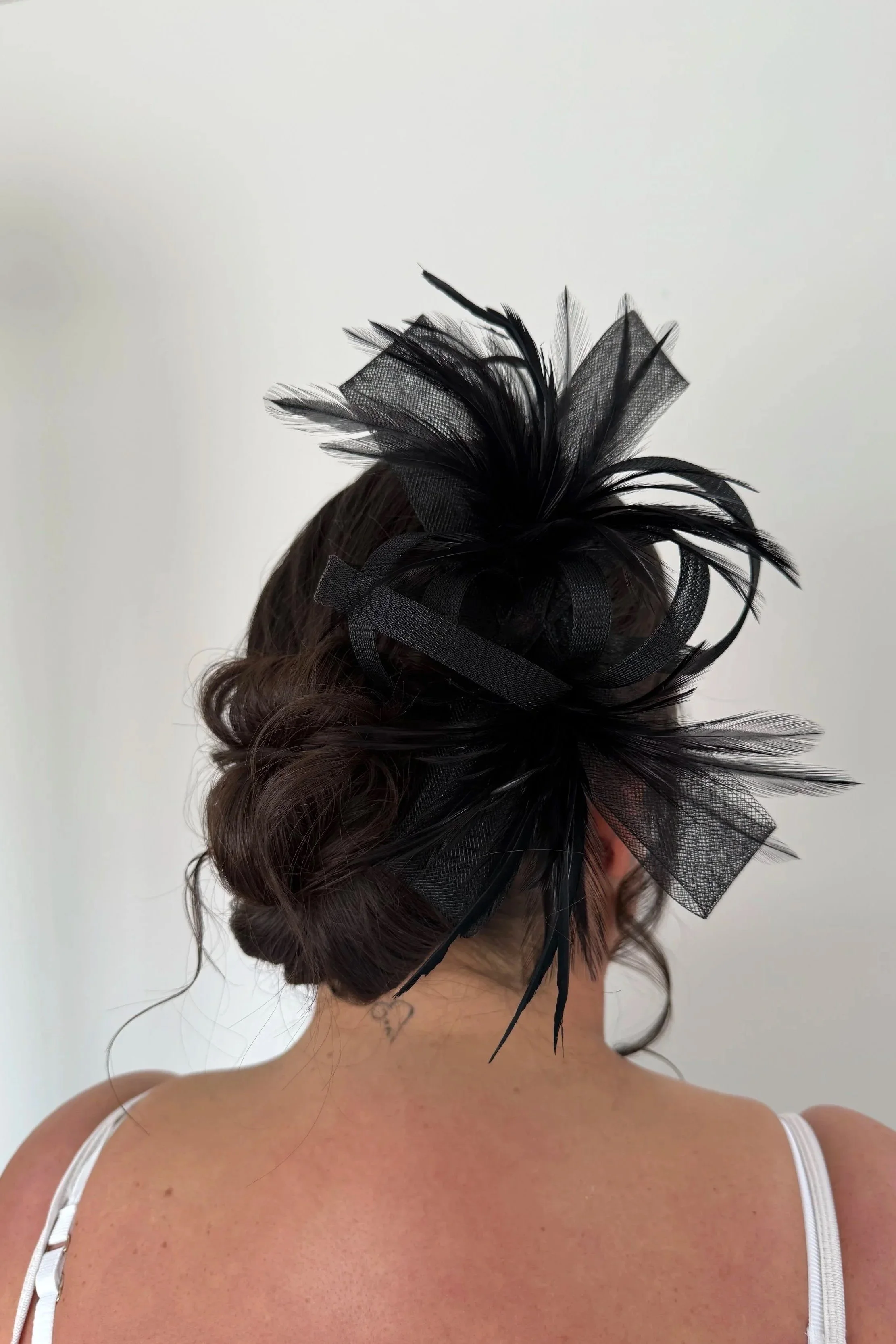 Wedding guest hair style with a fascinator 