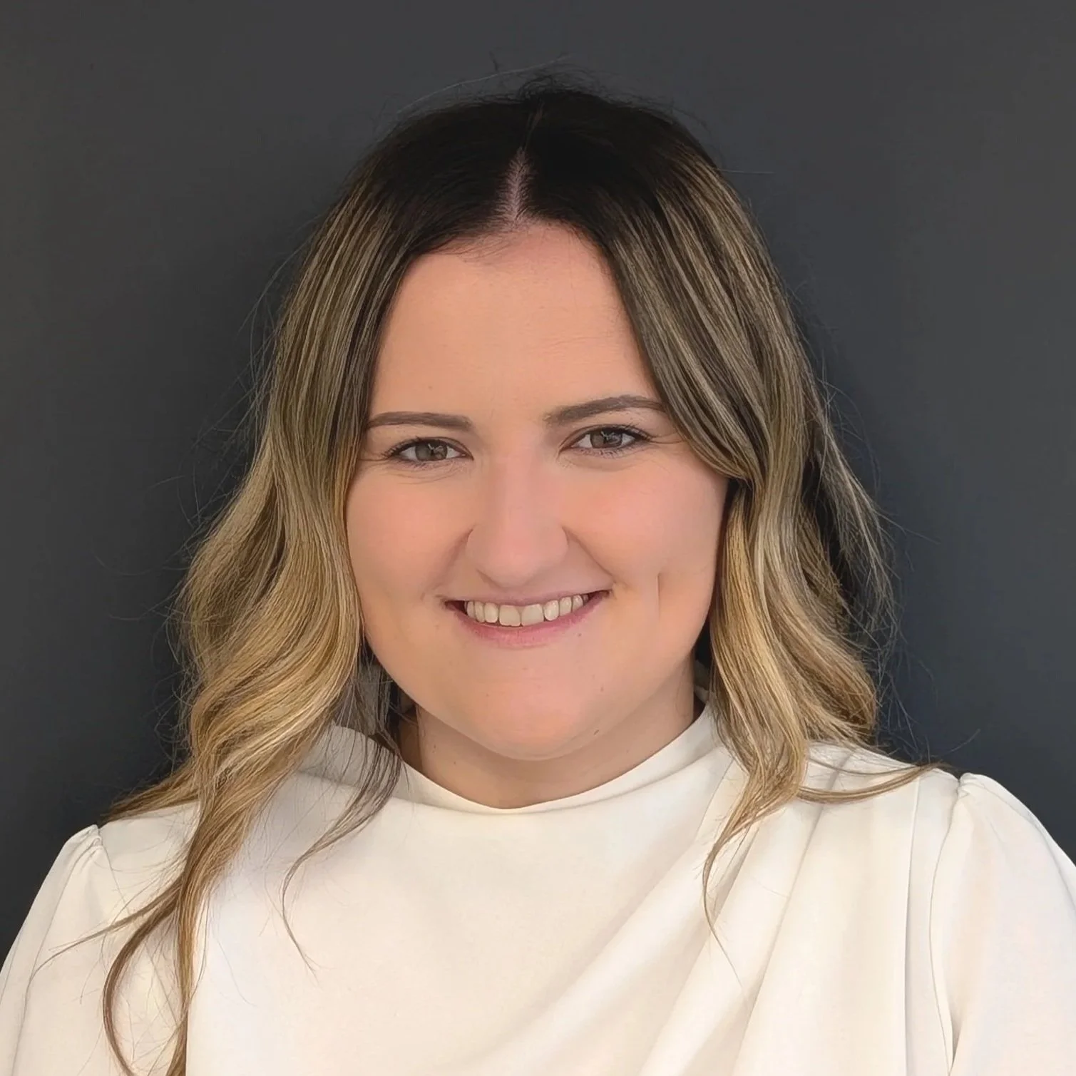 Outline of a person inside a square focus frame, symbolizing facial recognition or identification.