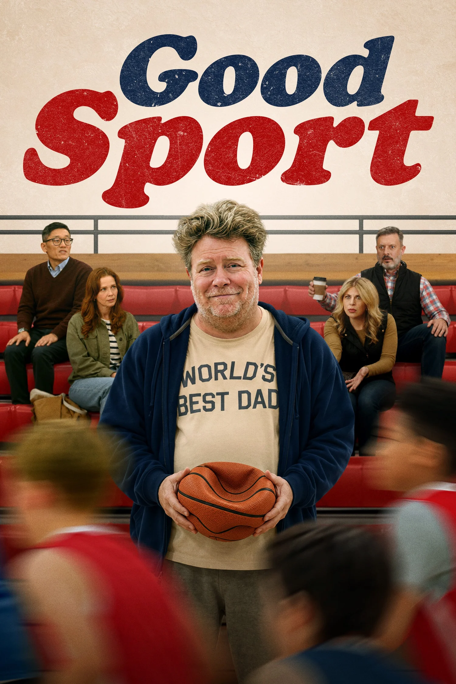 Good Sport poster — Pat holds a basketball in a school gym as parents watch from the bleachers