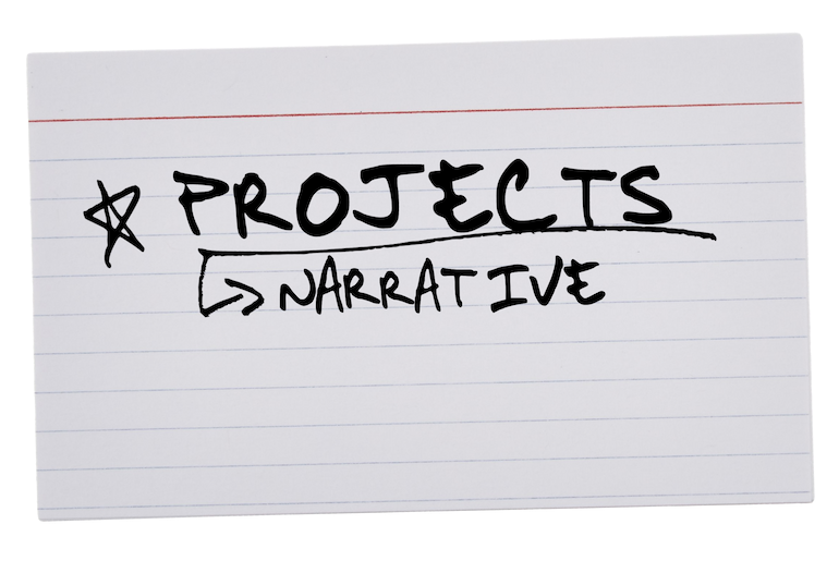 Handwritten notes on a white lined index card that read 'Projects' with an additional note 'Narrative' beneath, written inside a box with an arrow pointing to it.
