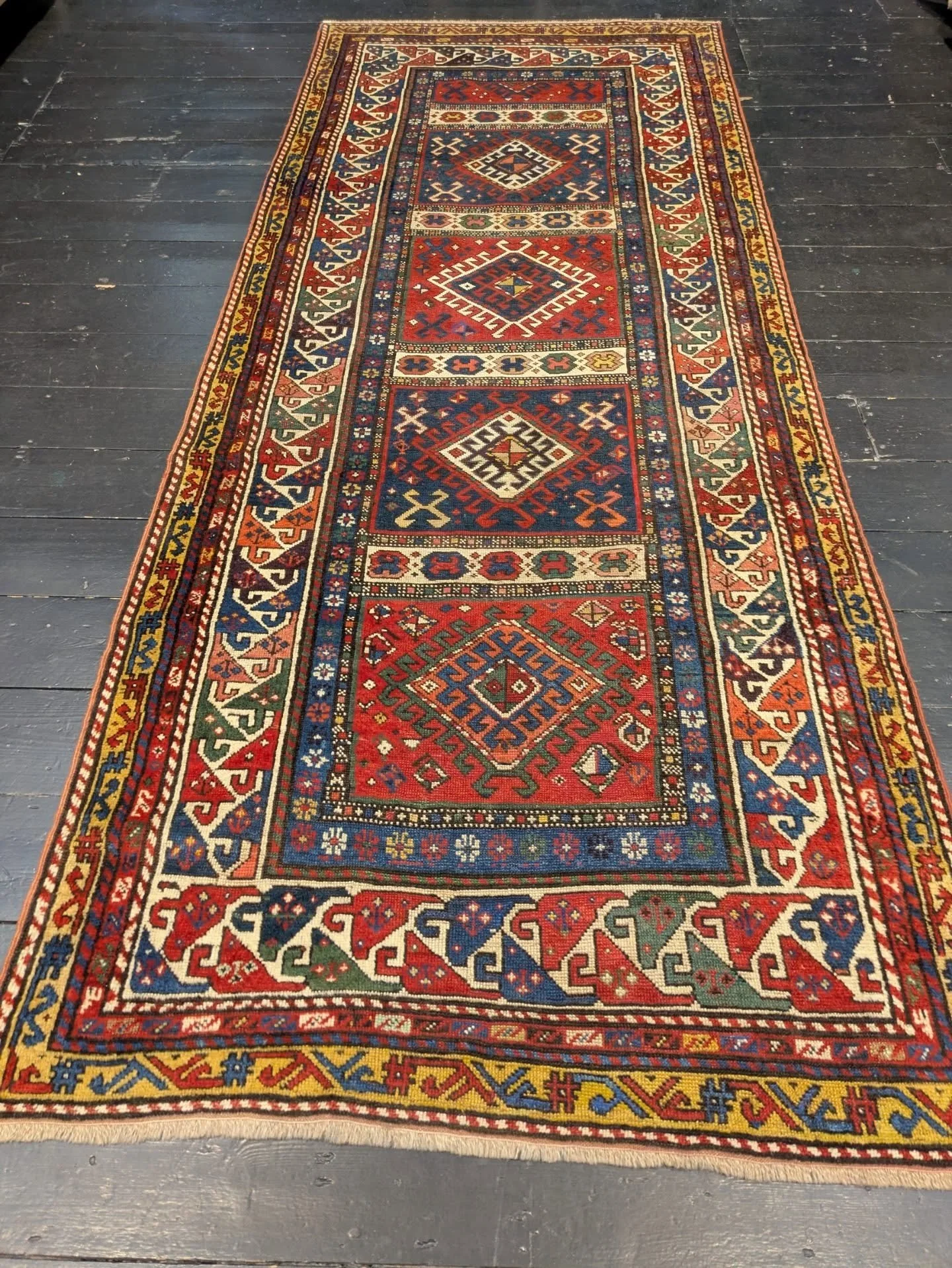 ~AVAILABLE~

Circa 1900, Antique Handmade Kazak Runner in excellent condition. 

These are extremely Rare nowadays! This particular piece has a luxurious pattern, especially the borders. 

This runner will grace any hallway 

Size: 273cm by 110cm 

P