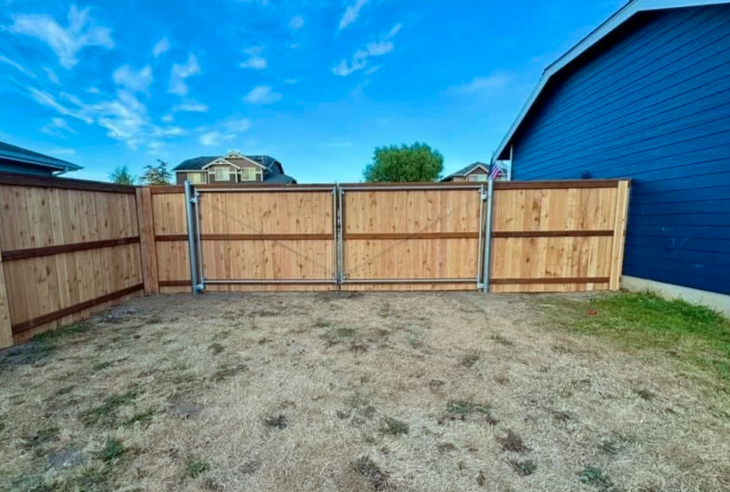 Modified cedar privacy fence with upgraded metal gate frame for durability