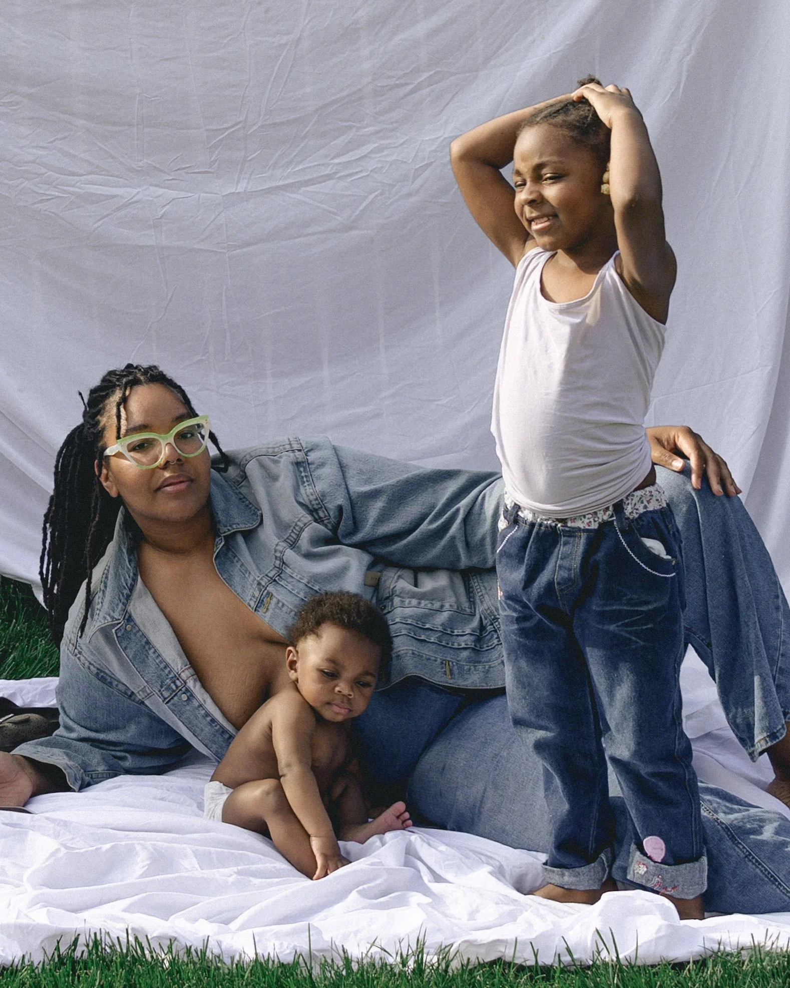 self portrait of black woman photographer in southeast michigan posing with her two young children