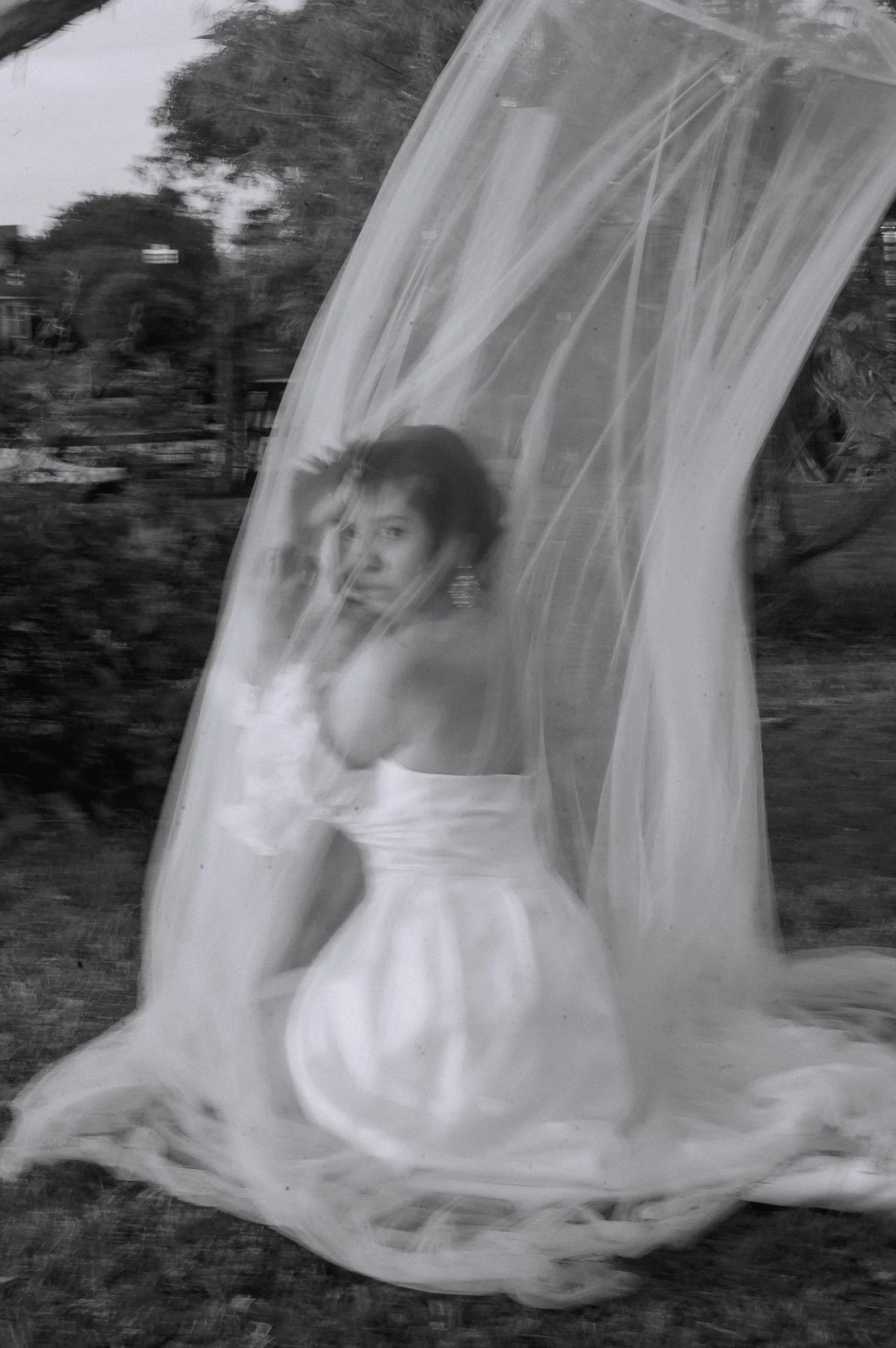 black and white motion blur bridal portrait photography featuring asian bride