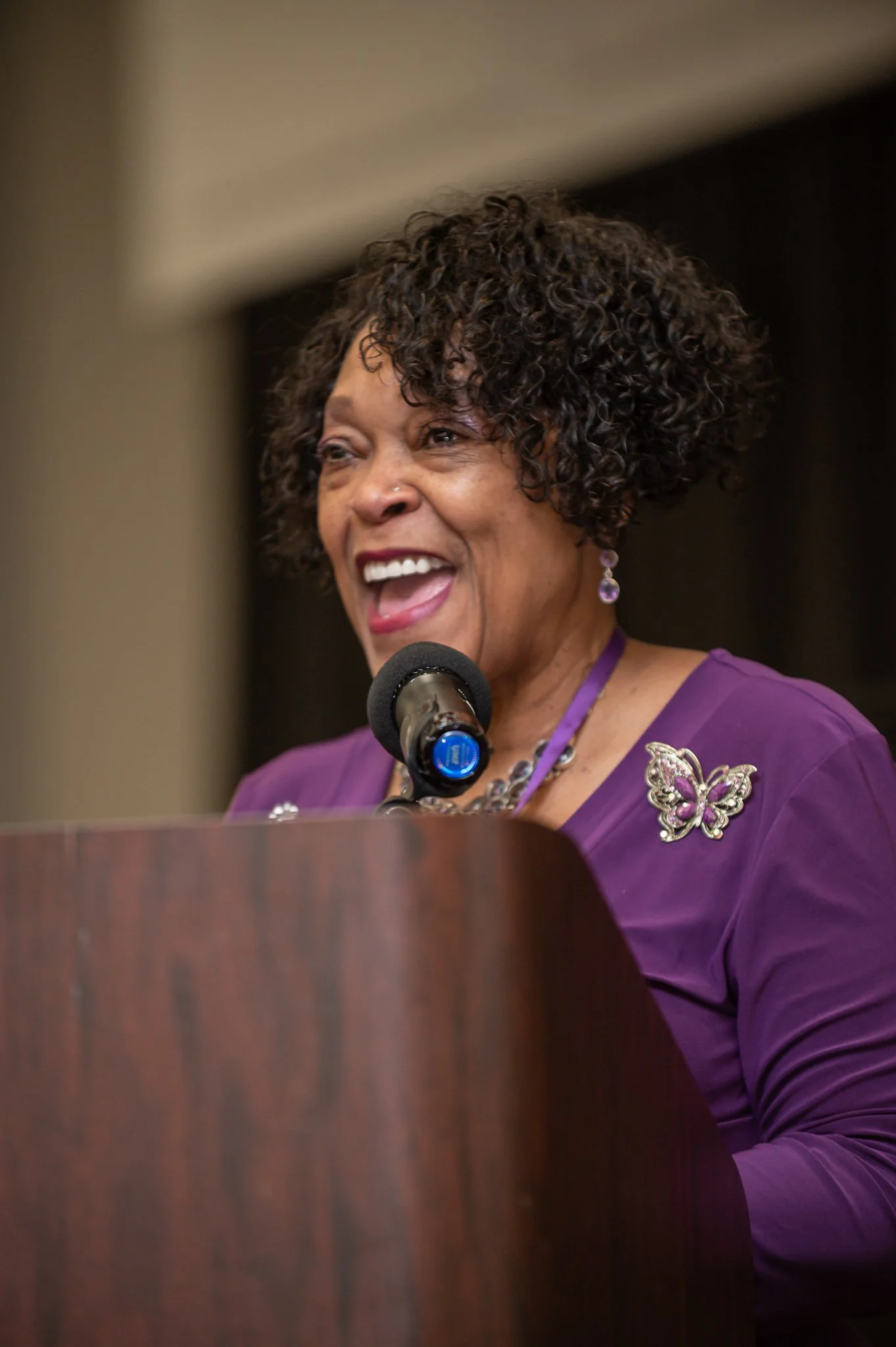 photo of older black woman speaking at a christian women's conference. photo taken by expert event photographer in detroit and se michigan