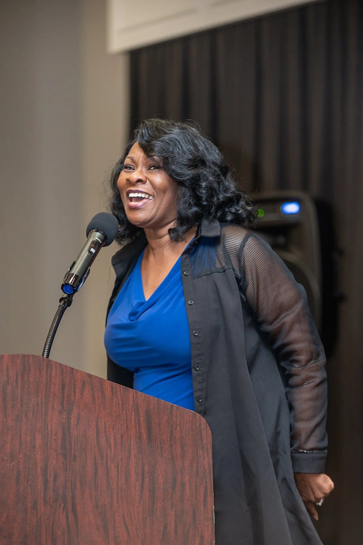 photo of woman preaching at church conference. photo taken by expert event photographer in detroit and se michigan