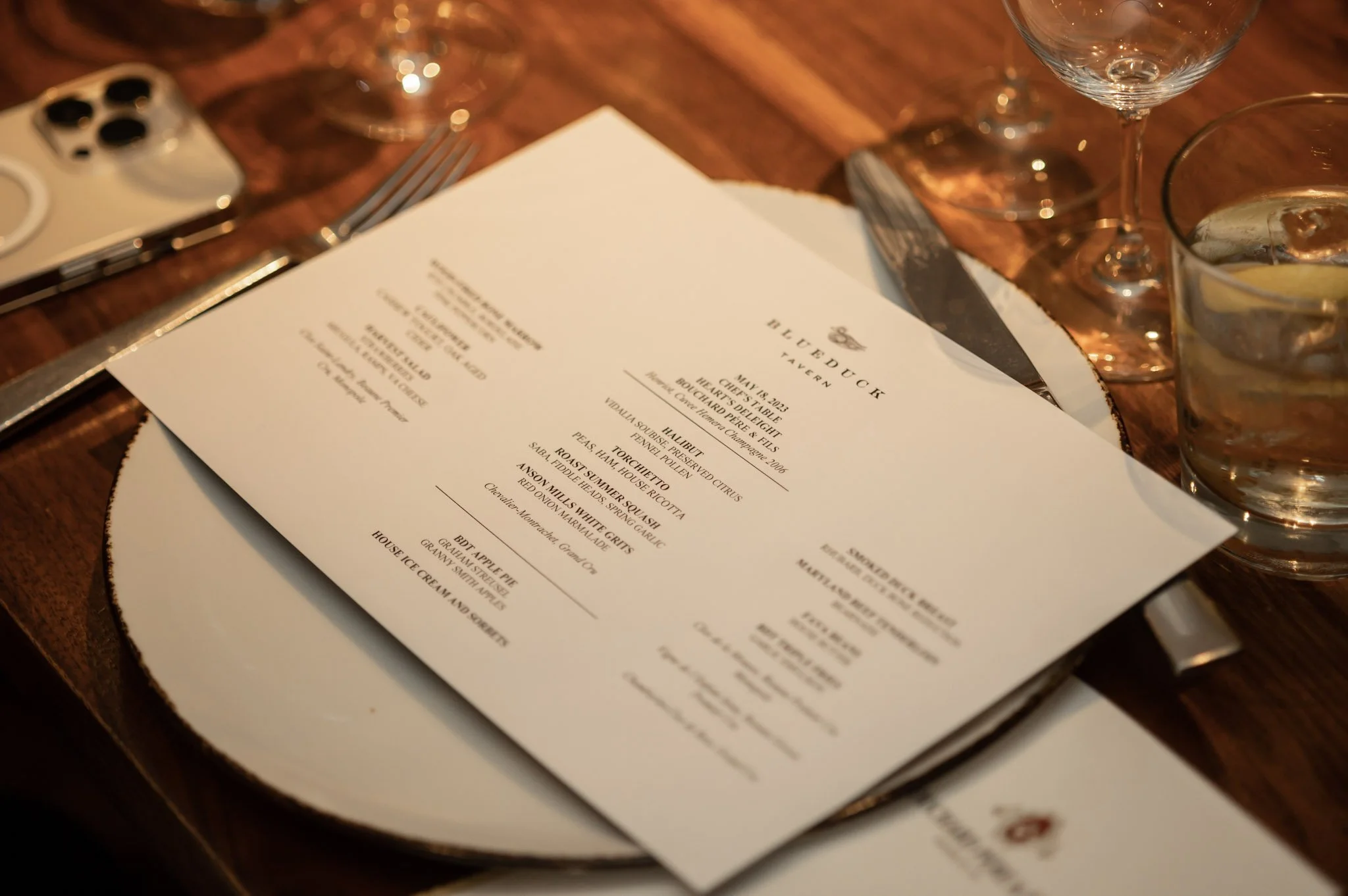photo of menu from blue duck tavern during charity fundraiser wine tasting event. photo taken by black woman corporate event photographer in detroit and se michigan