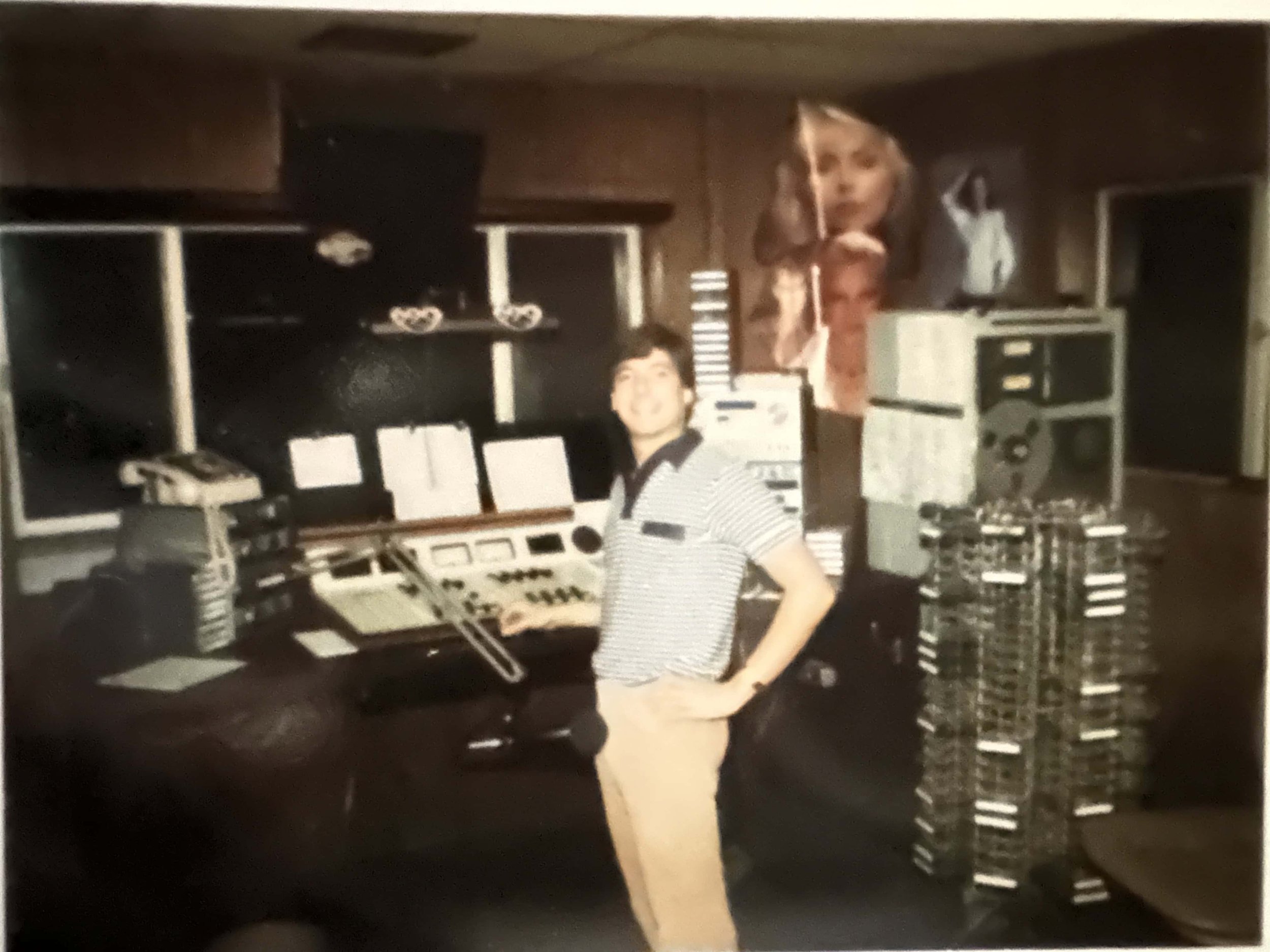 In wood paneled the studio at The Mighty 690 in Baja Malibu south of Tijuana, Mexico, on the air.