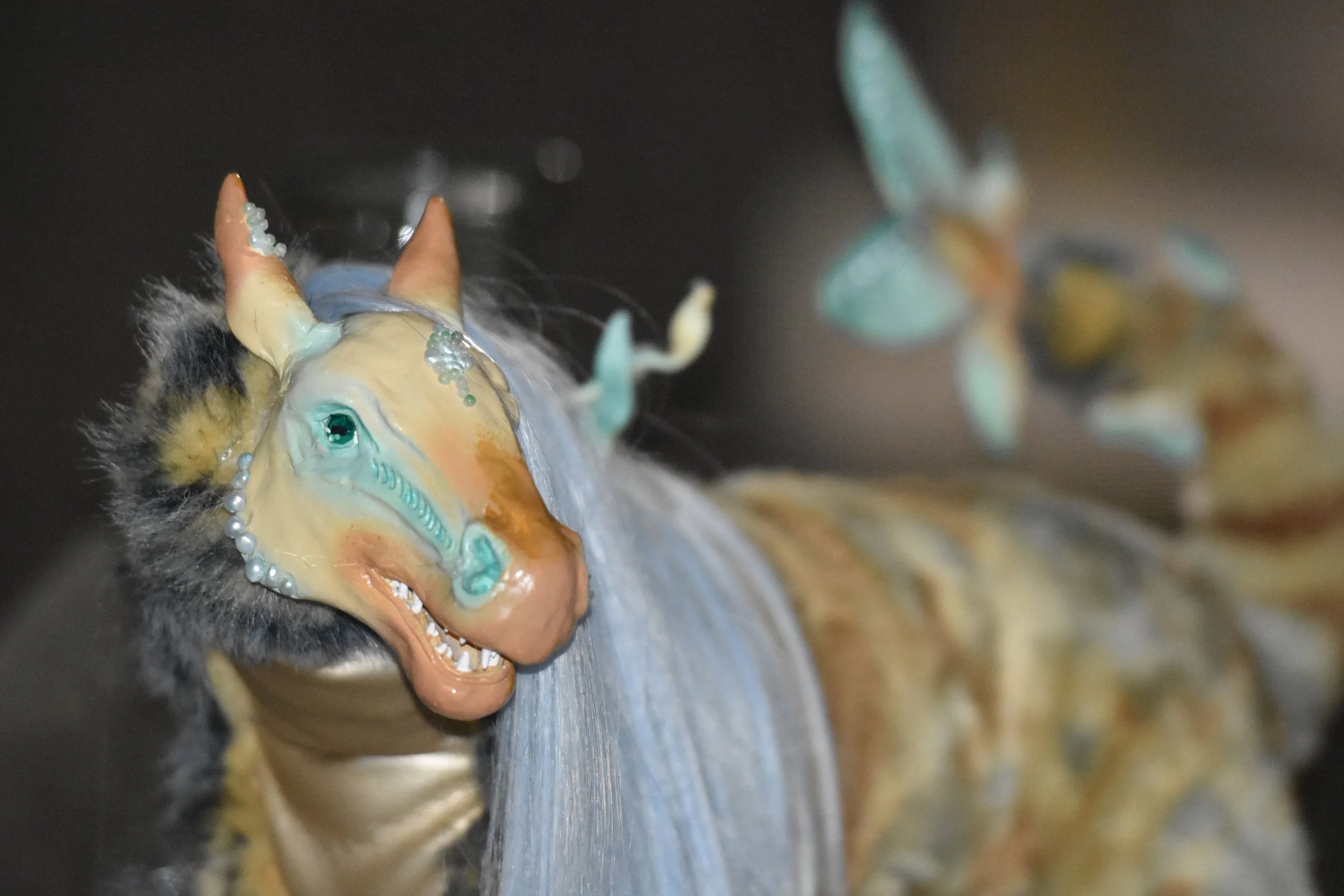 All elements are hand-made with polymer clay, faux fur, wire, airbrush paint, and saltwater pearls.