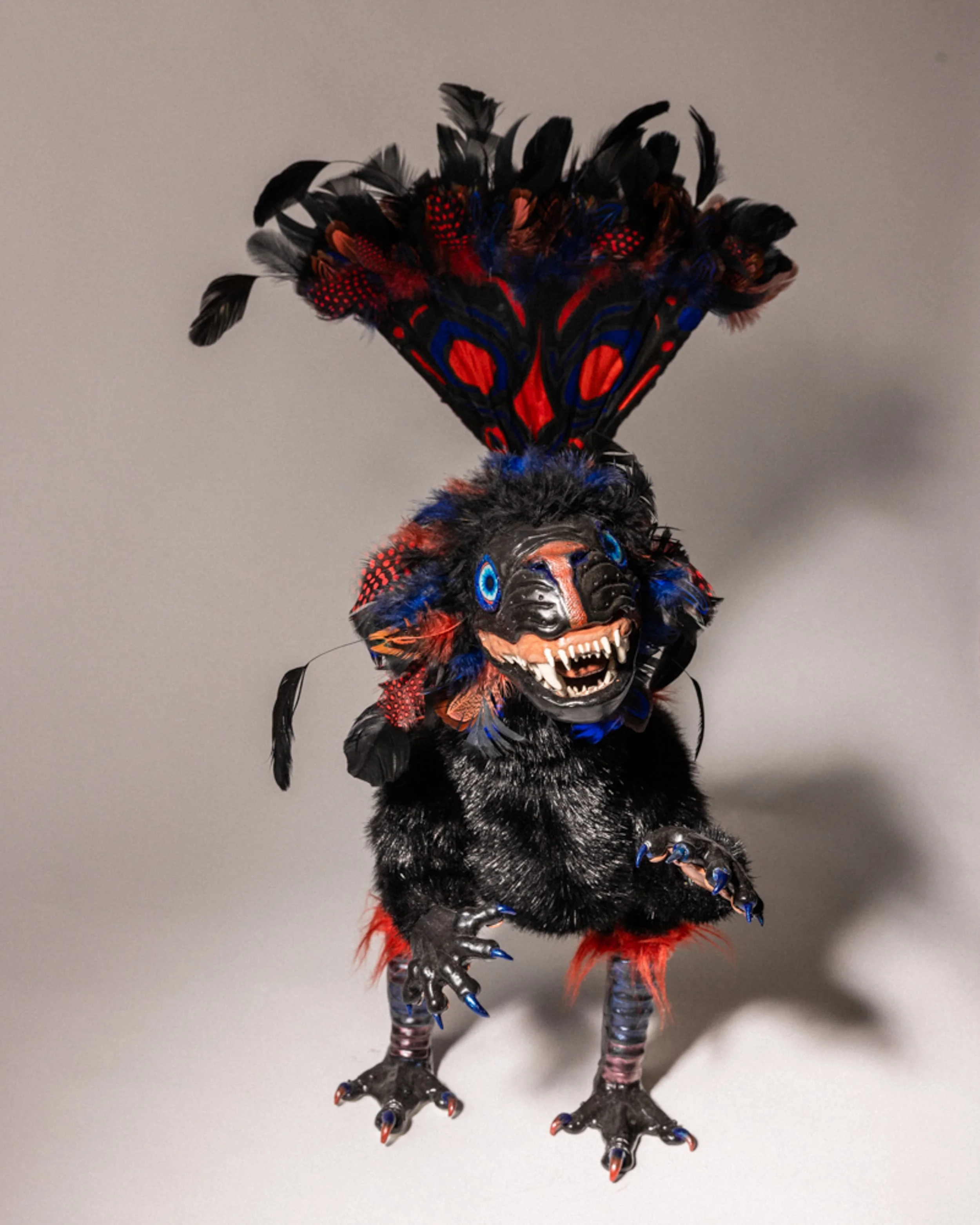 Faux fur, feathers, hand-dyed silk, wire, batting, polymer clay, hand-build bamboo fan