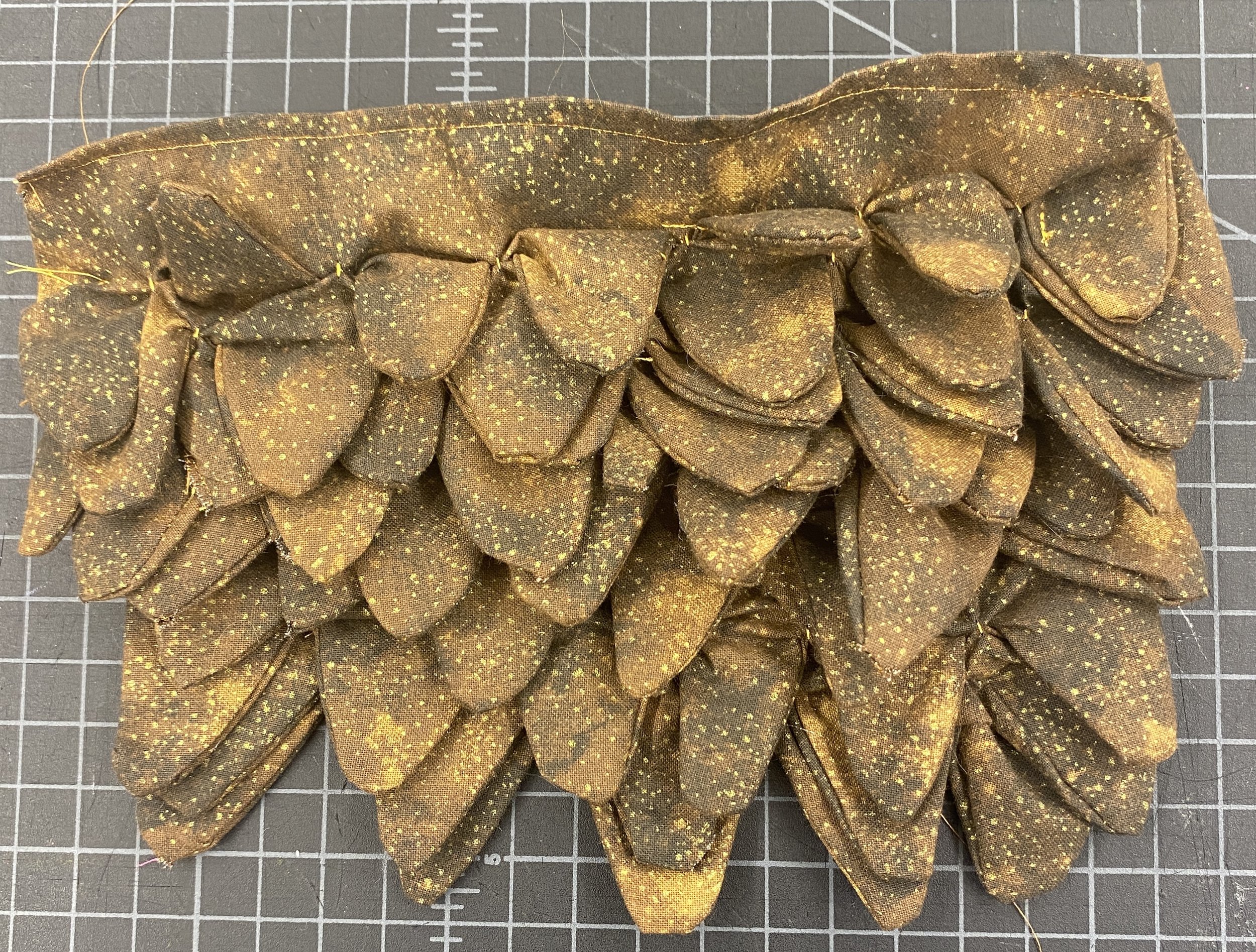 Pangolian Skin: twelve layers of contoured tucks made from patterned cotton