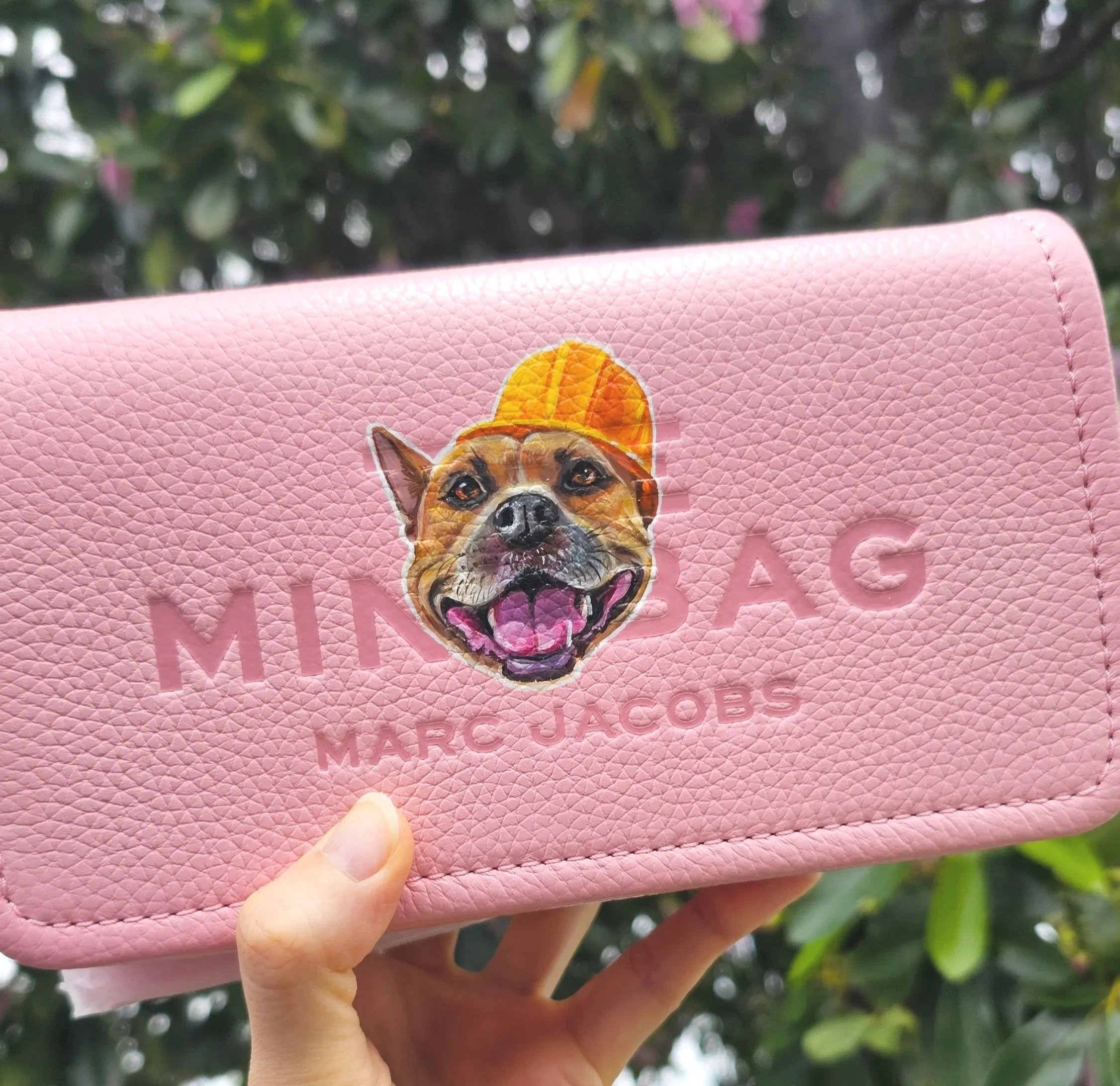 Custom painted dog on Marc Jacobs pink bag by artist Maili Nina from Honolulu, Hawaii. She offers hand-painted pet portrait customization.