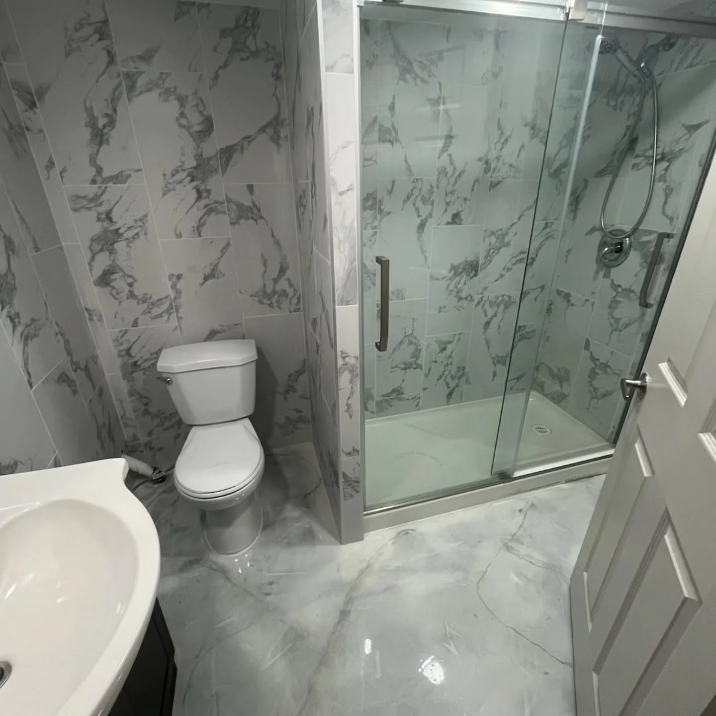 Customer requested epoxy and tiles on the walls for their basement bathroom| B&E General Contarctors #HomeRenovation #bathroomrenovation #epoxy #DreamHome #edmonton #yeg